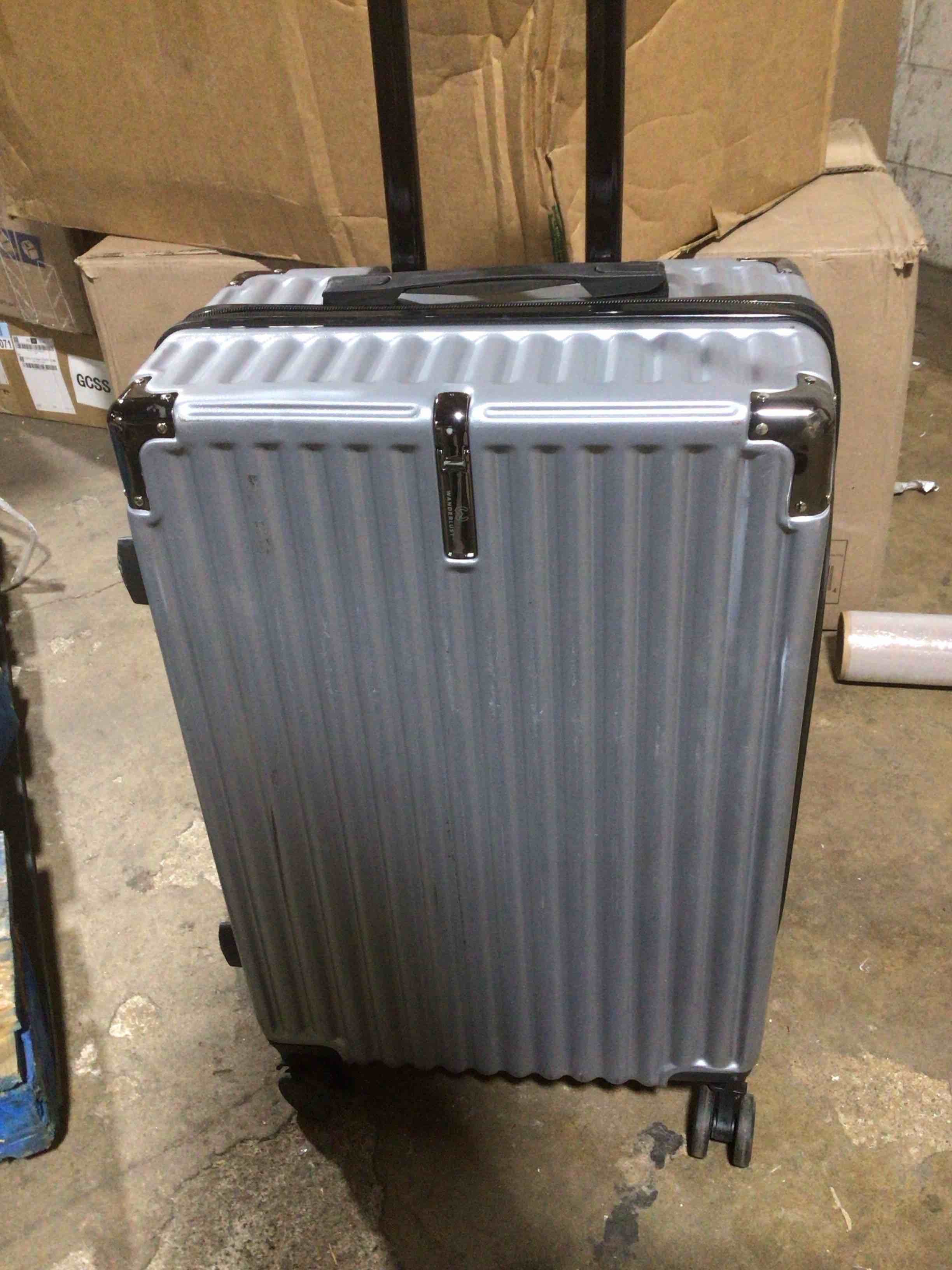 Condition photo showing As Is for (USED)gray metallic suitcase, for traveling 