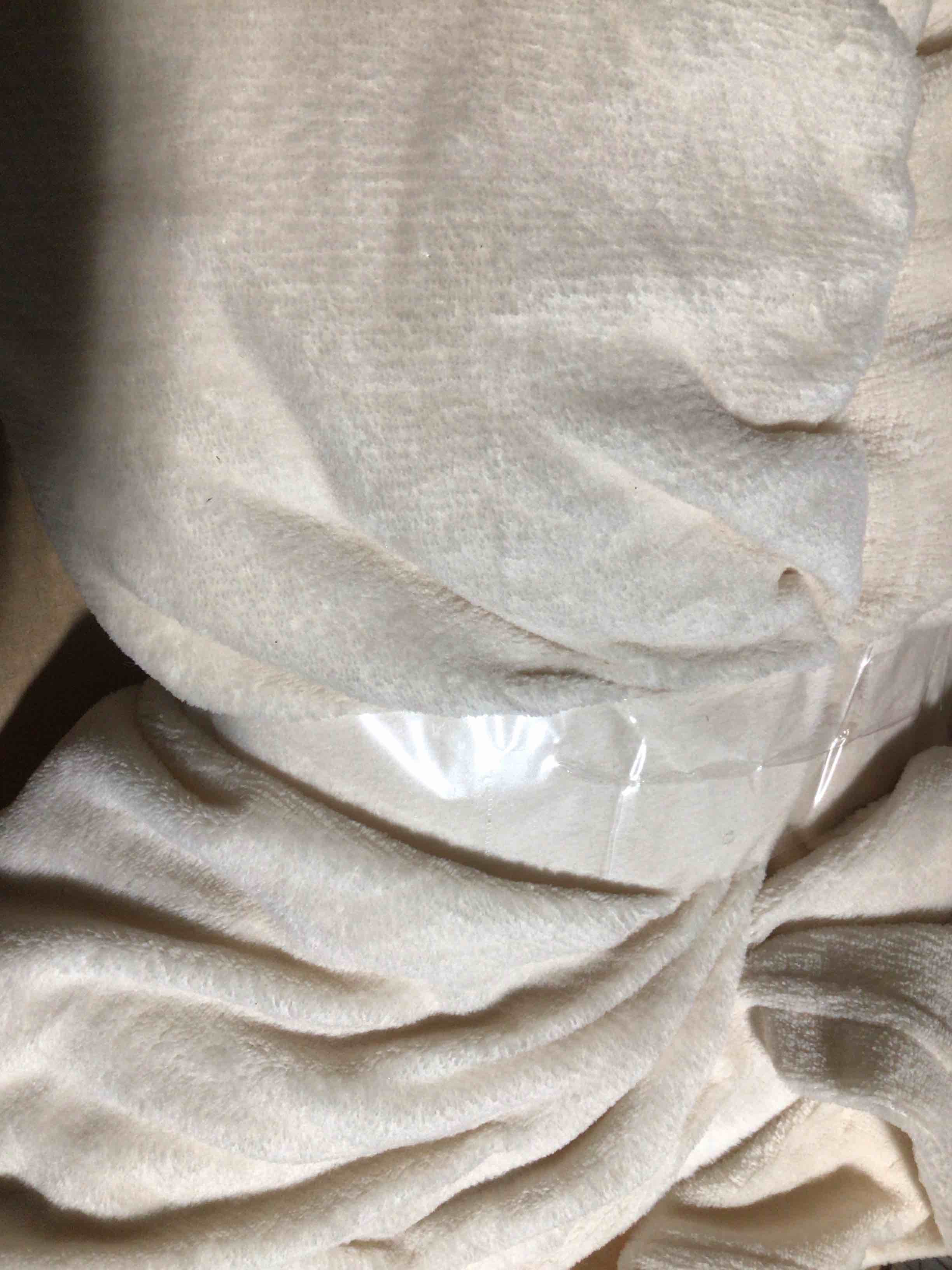 Condition photo showing New/Like New for cream/beige soft blanket 