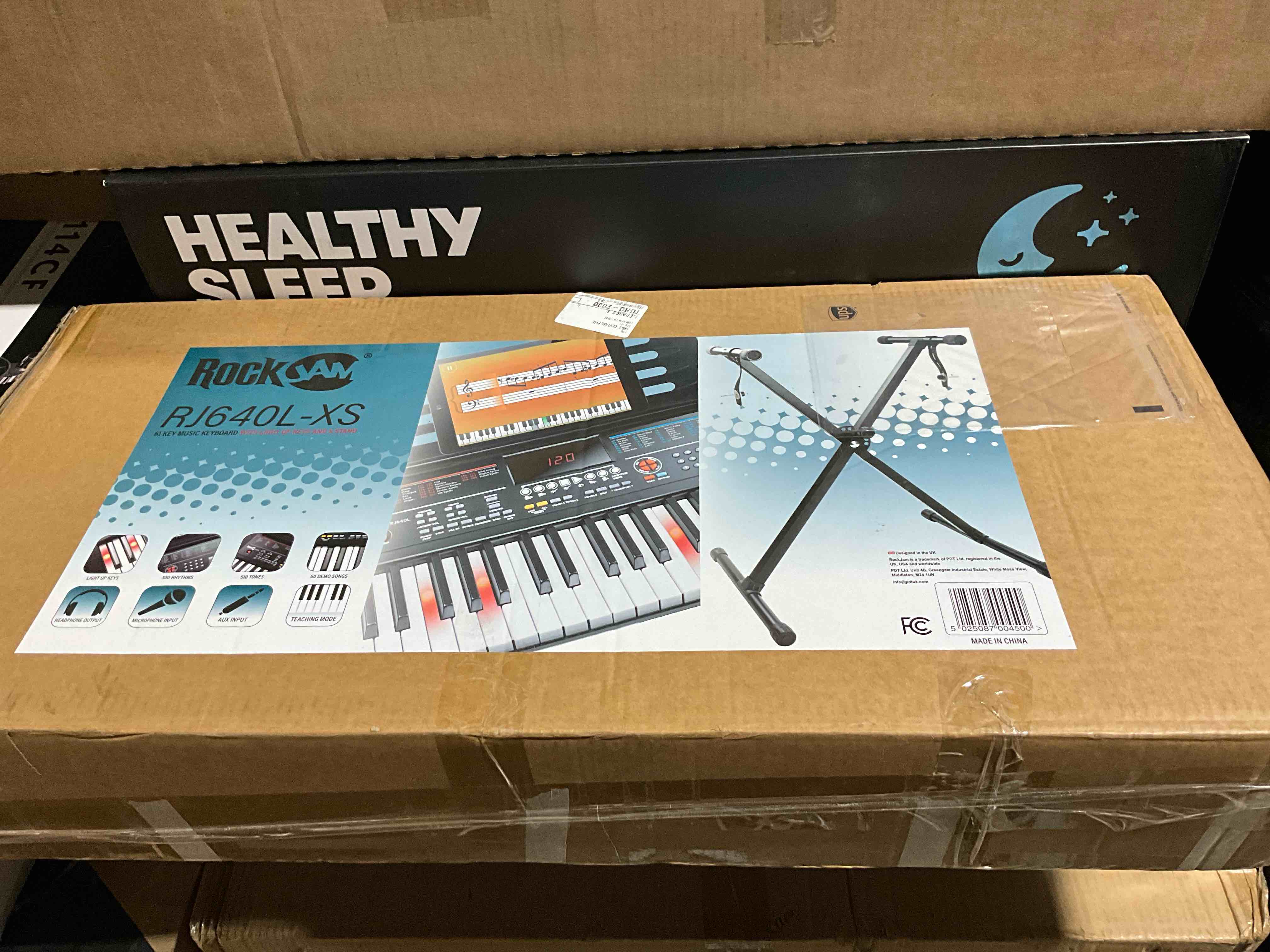 Condition photo showing New/Like New for RockJam 61 Key Light Up Keyboard Piano Kit with Keyboard Stand, Sheet Music Stand, & Lessons, Black