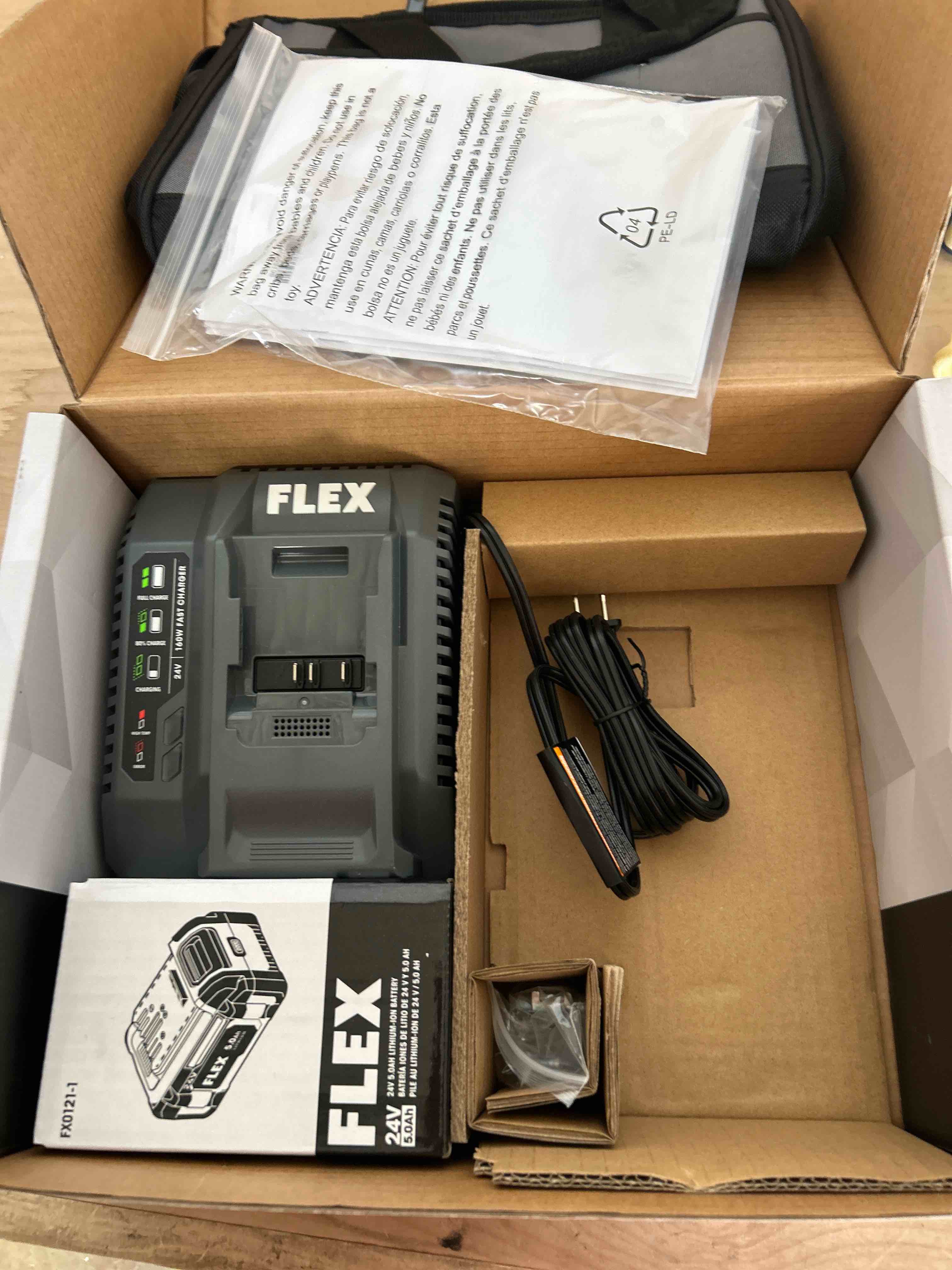 Condition photo showing New/Like New for FLEX 24V Lithium-Ion Starter Kit with 5.0Ah Lithium Battery and 160W Fast Charger - FX0411-1C