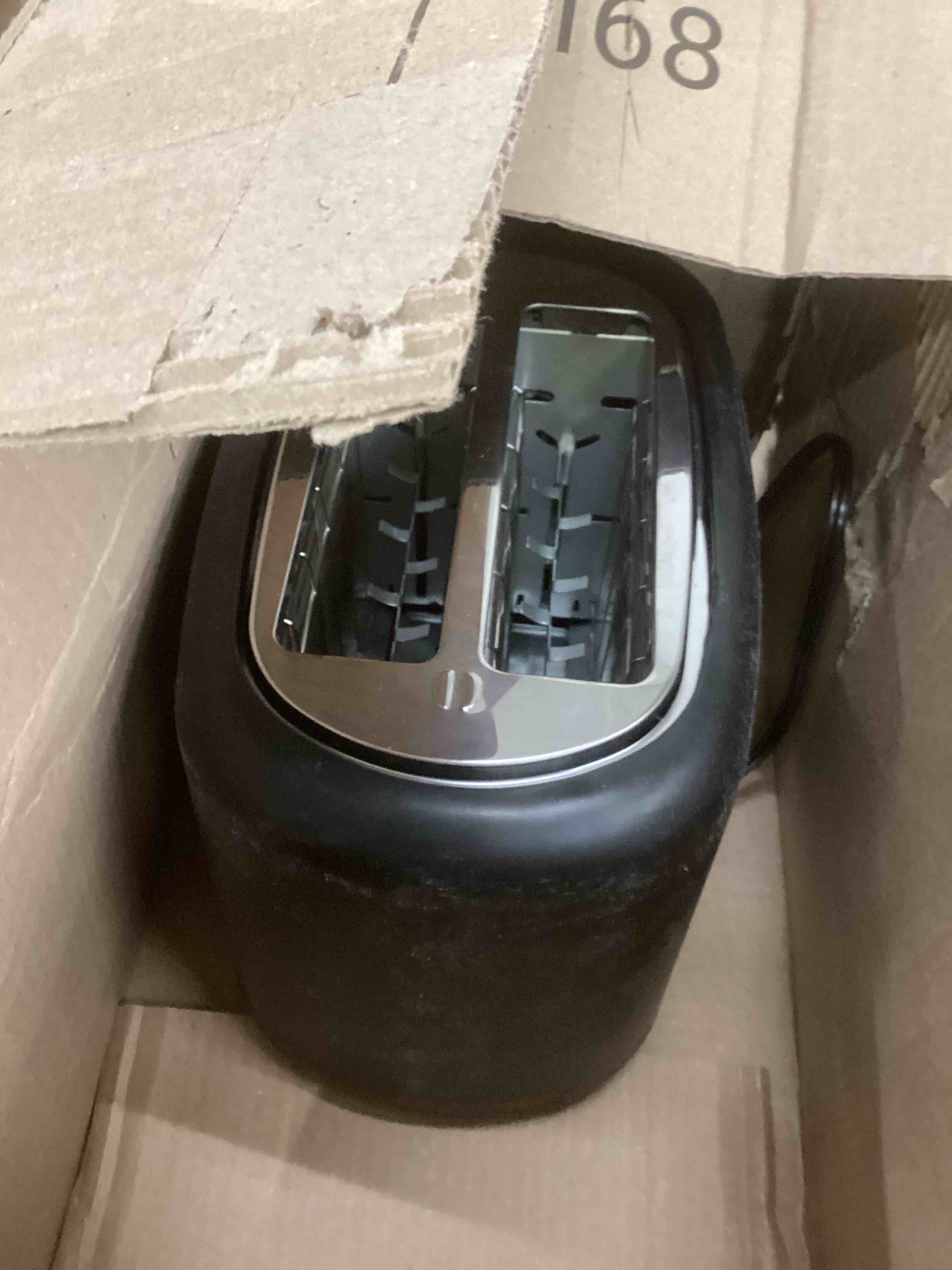 Condition photo showing As Is for Amazon Basics 2 Slice Toaster, With 6 Browning Settings, Extra Wide Slots For Bagels and Special Breads, Removable Easy-to-Clean Crumb Tray, Cancel/Defrost/Bagel Buttons, 900W, Black & Silver 2 Slice Silver Front