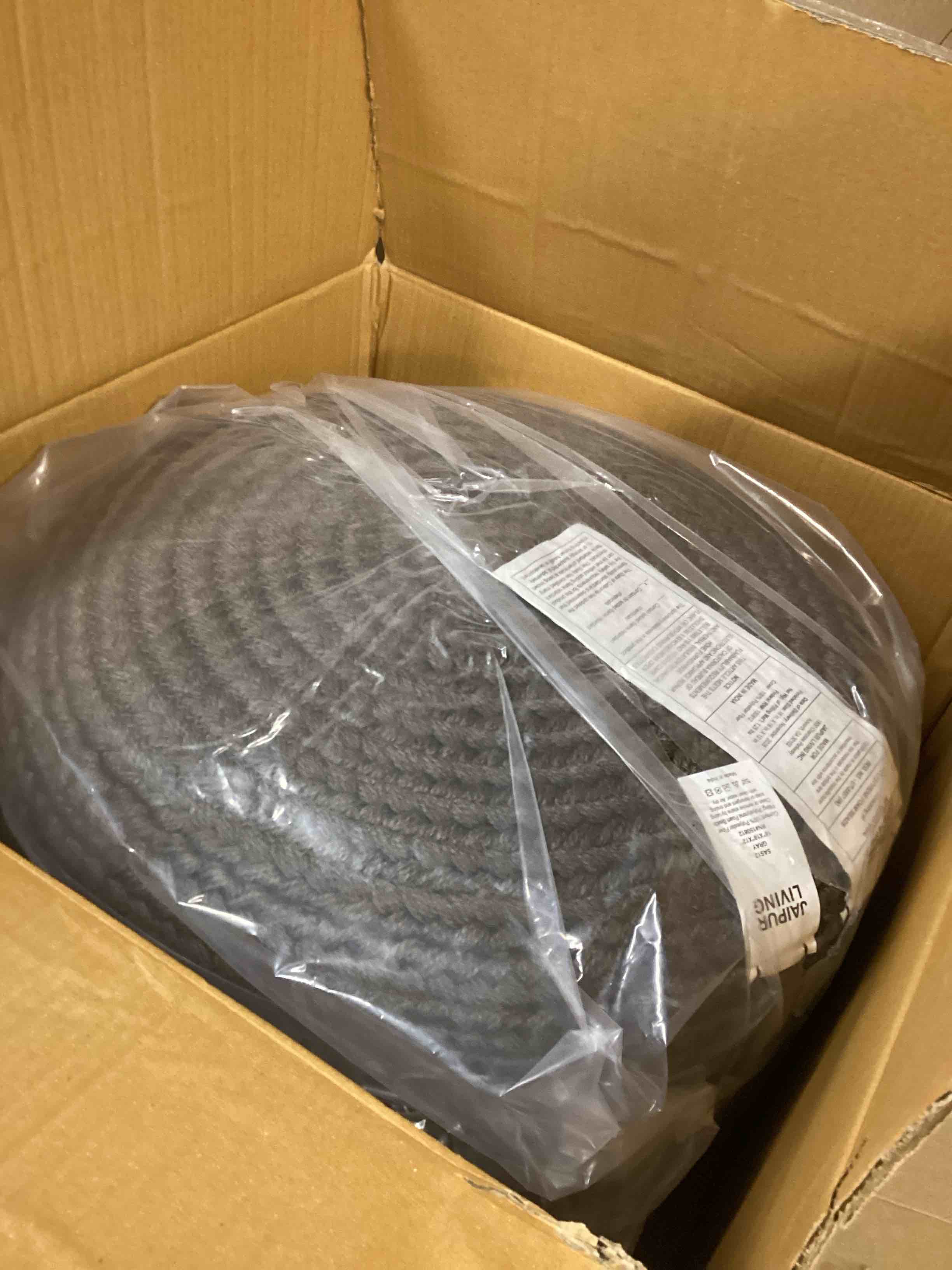 Condition photo showing New/Like New for Dalenna Round Outdoor Ottoman grey 