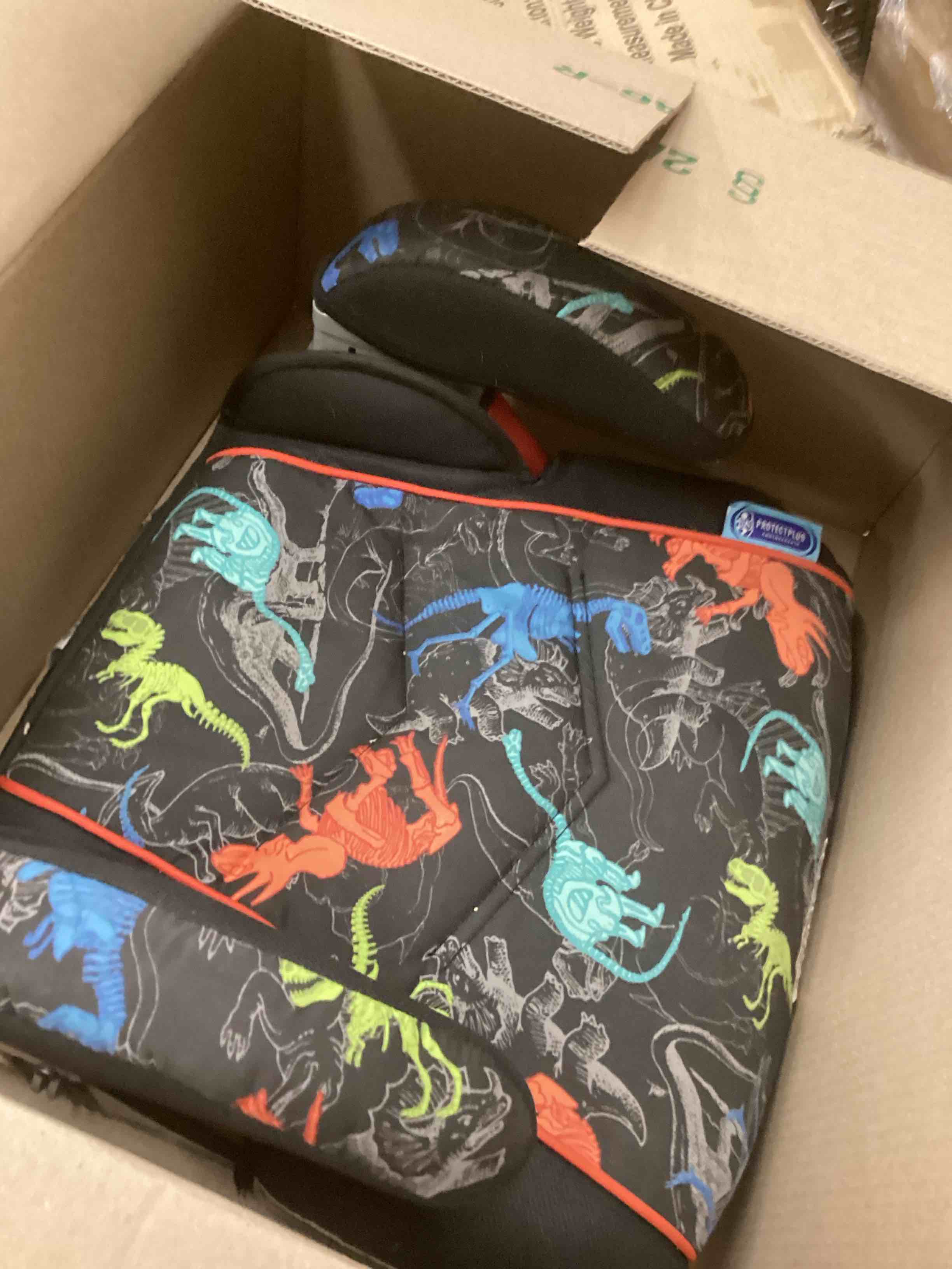 Condition photo showing As Is for Graco TurboBooster Backless Booster Car Seat, Dinorama, for Ages 4-10, 40-100 Pounds, Up to 57 Inches Tall