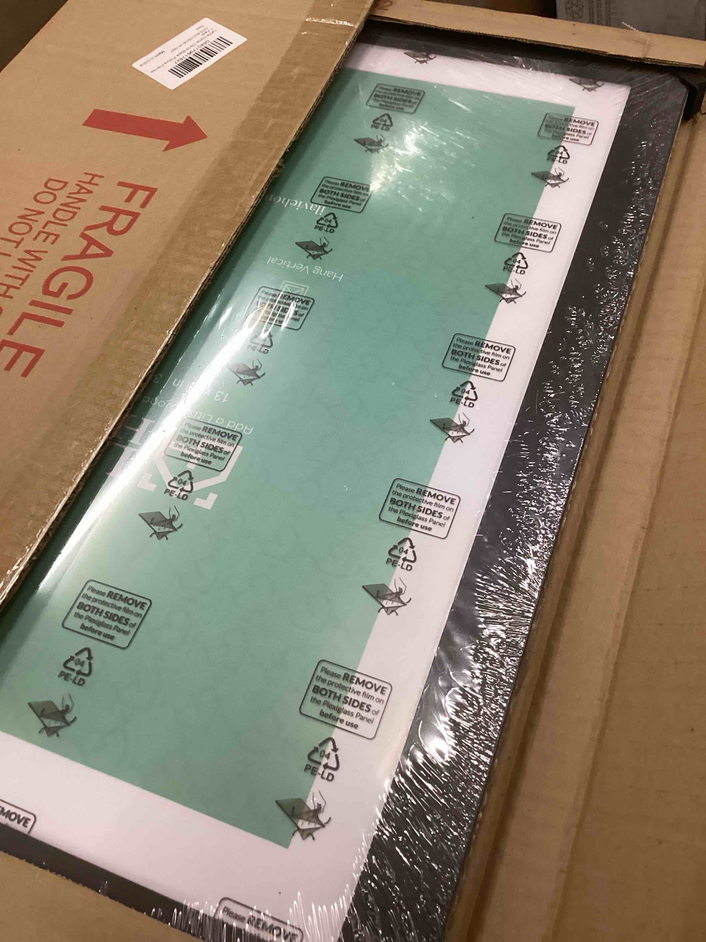 Condition photo showing New/Like New for LaVie Home 13x19 Picture Frame Black Poster Frame, Display Pictures 11x17 with Mat or 13x19 Without Mat, Stable and Sturdy Frame and Polished Plexiglass, Horizontal and Vertical Format of The Walls