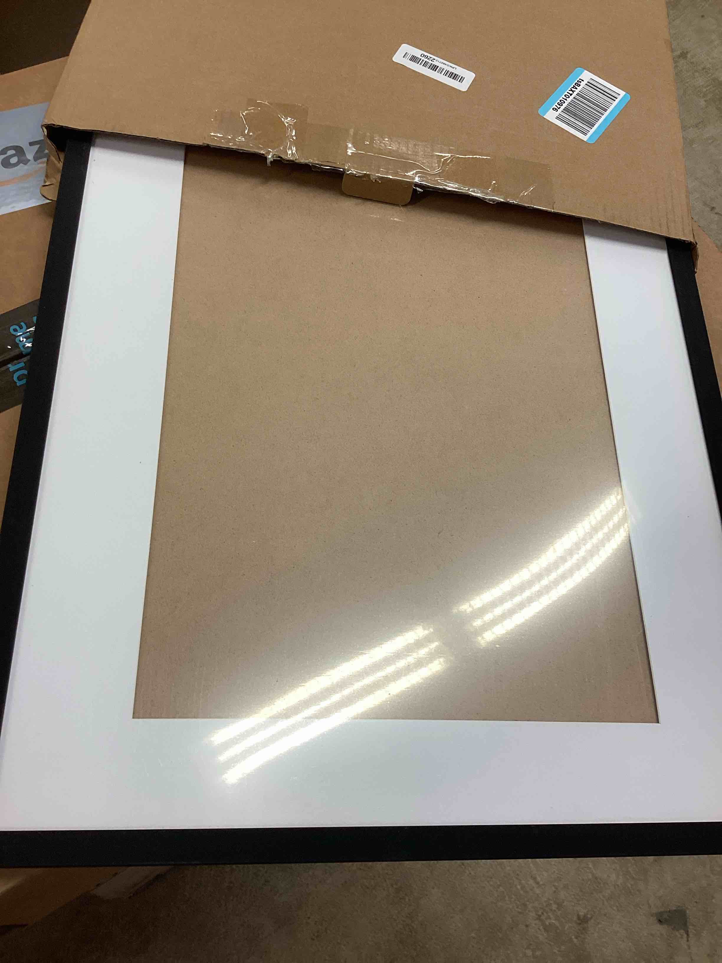 Condition photo showing Good Condition for upsimples 17x22 Picture Frame, Display Pictures 12x18 with Mat or 17 x 22 Without, Wall Hanging Poster Frames, Black, 1 Pack Black 17x22