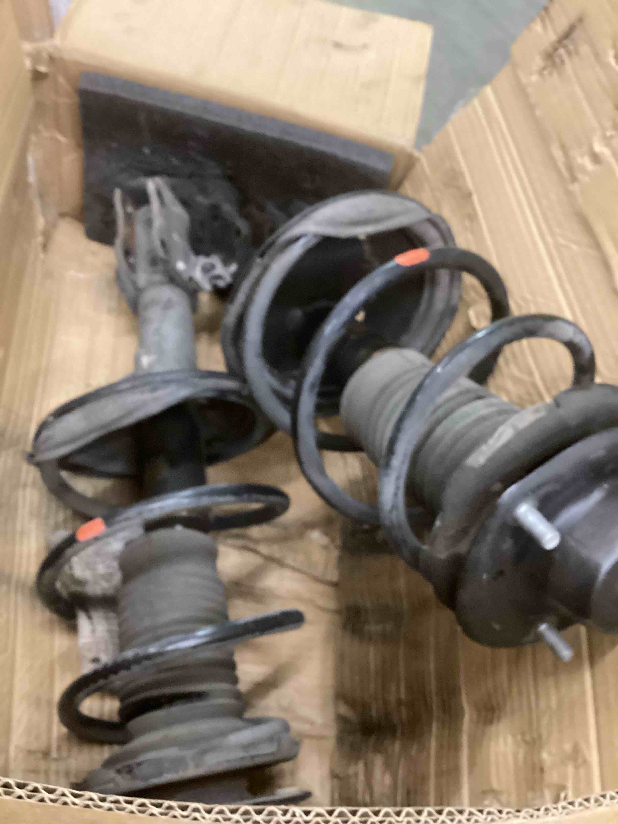 Condition photo showing As Is for  Rear Left & Right Struts and Shocks Complete Assembly 