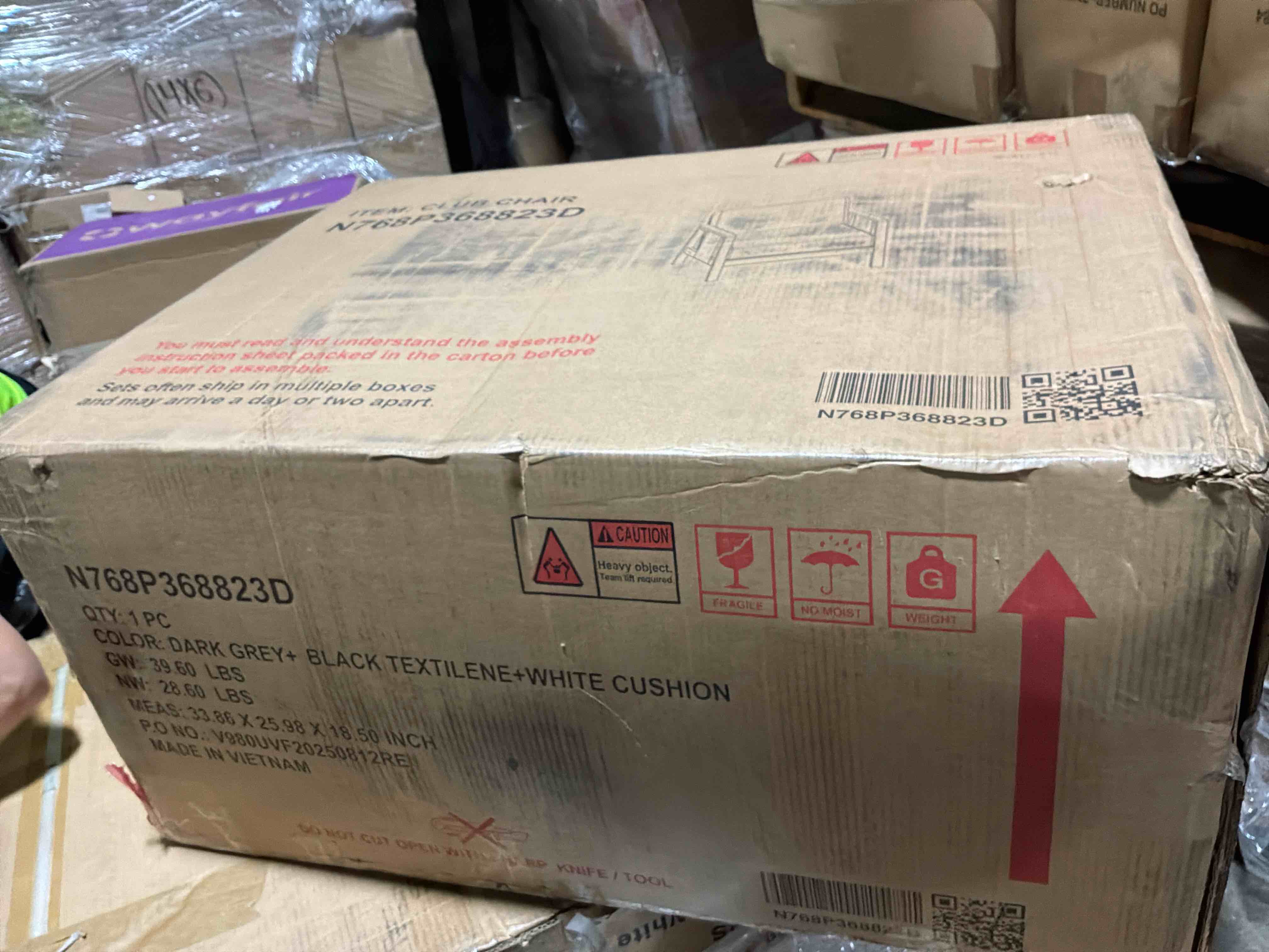 Condition photo showing New/Like New for brown teak outdoor lounge chair with dark gray cushions