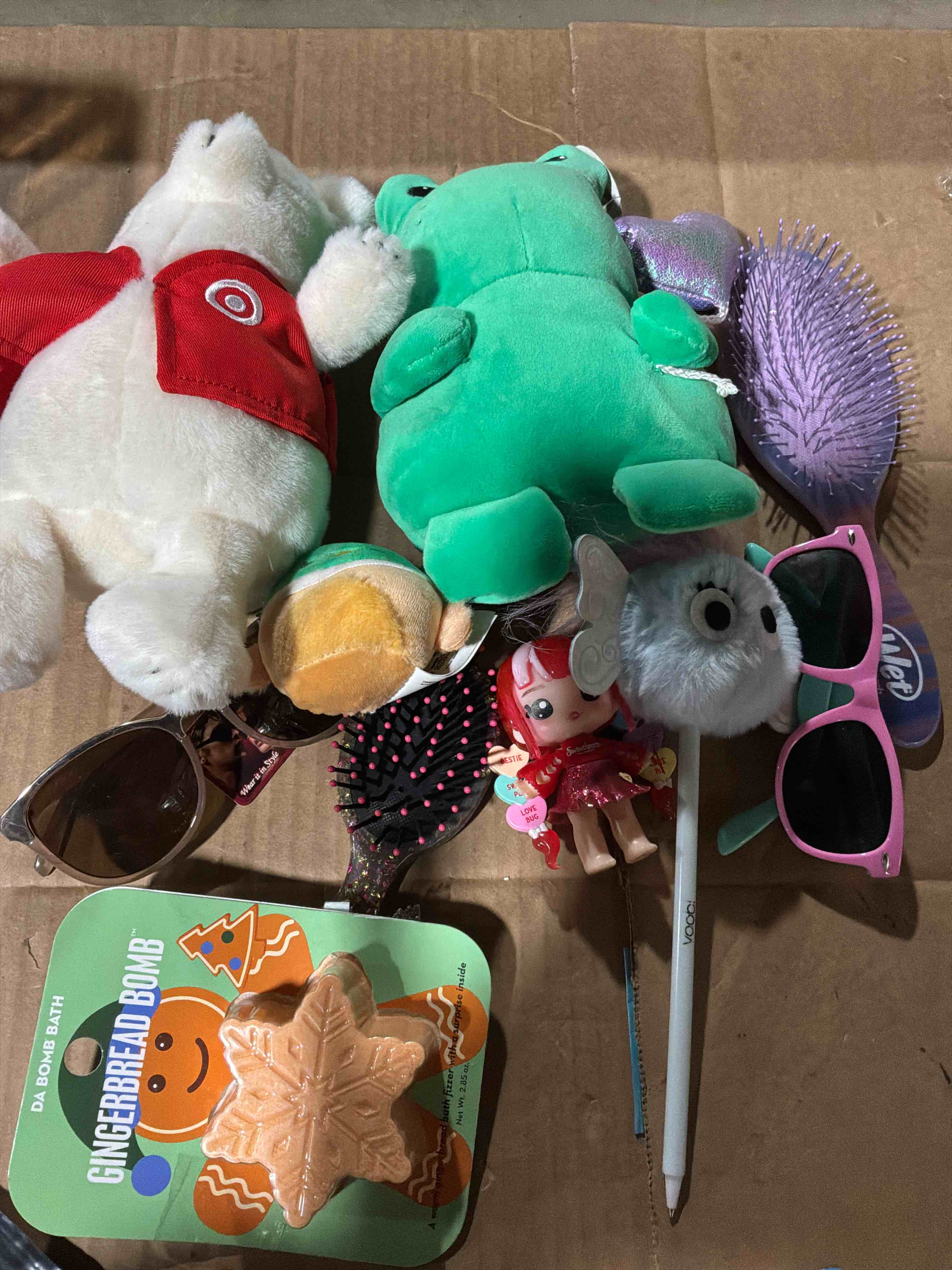 Condition photo showing New/Like New for A variety of things such as a plush toy, glasses ,a comb etc