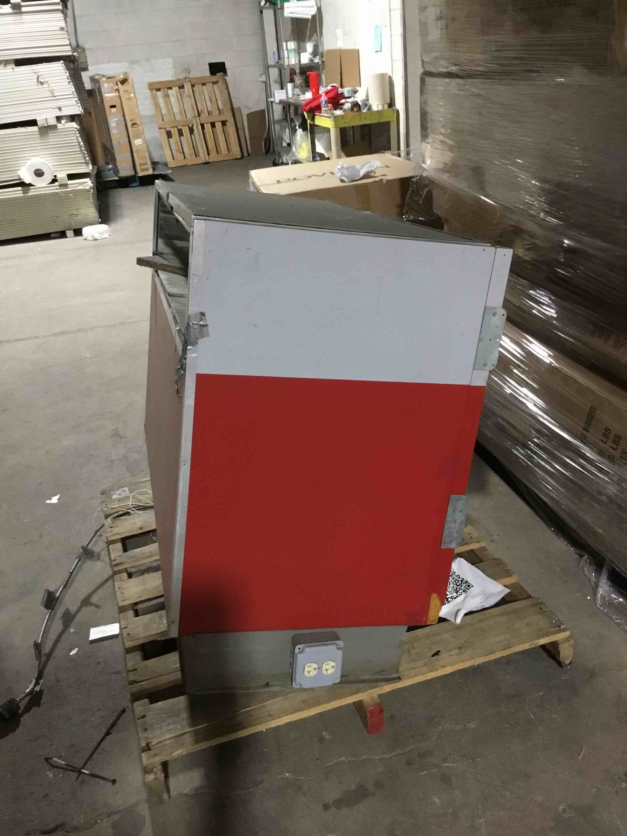 Condition photo showing As Is for commercial display with storage doors 