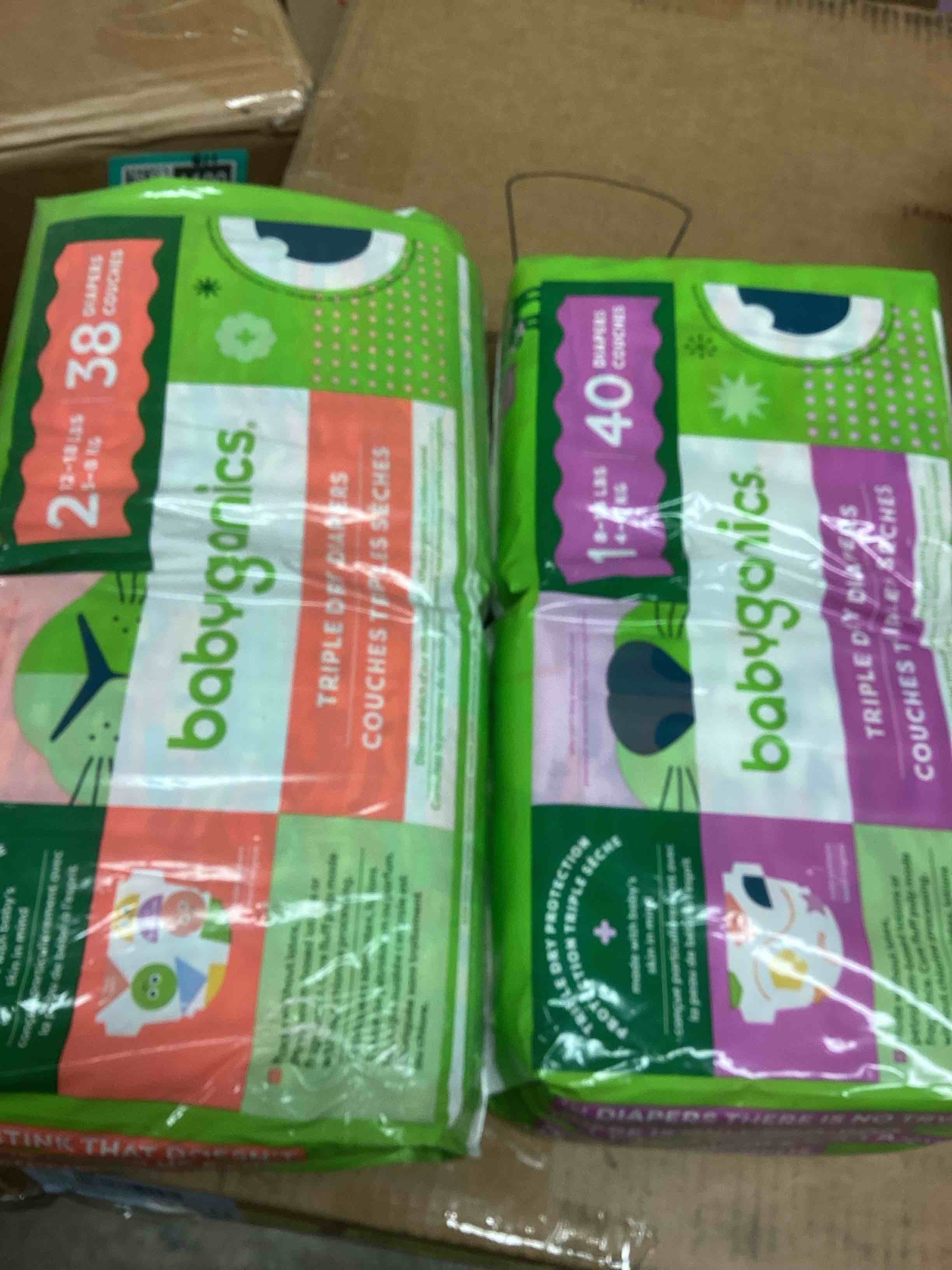 Condition photo showing New/Like New for assorted baby diapers (size 2 and 1)