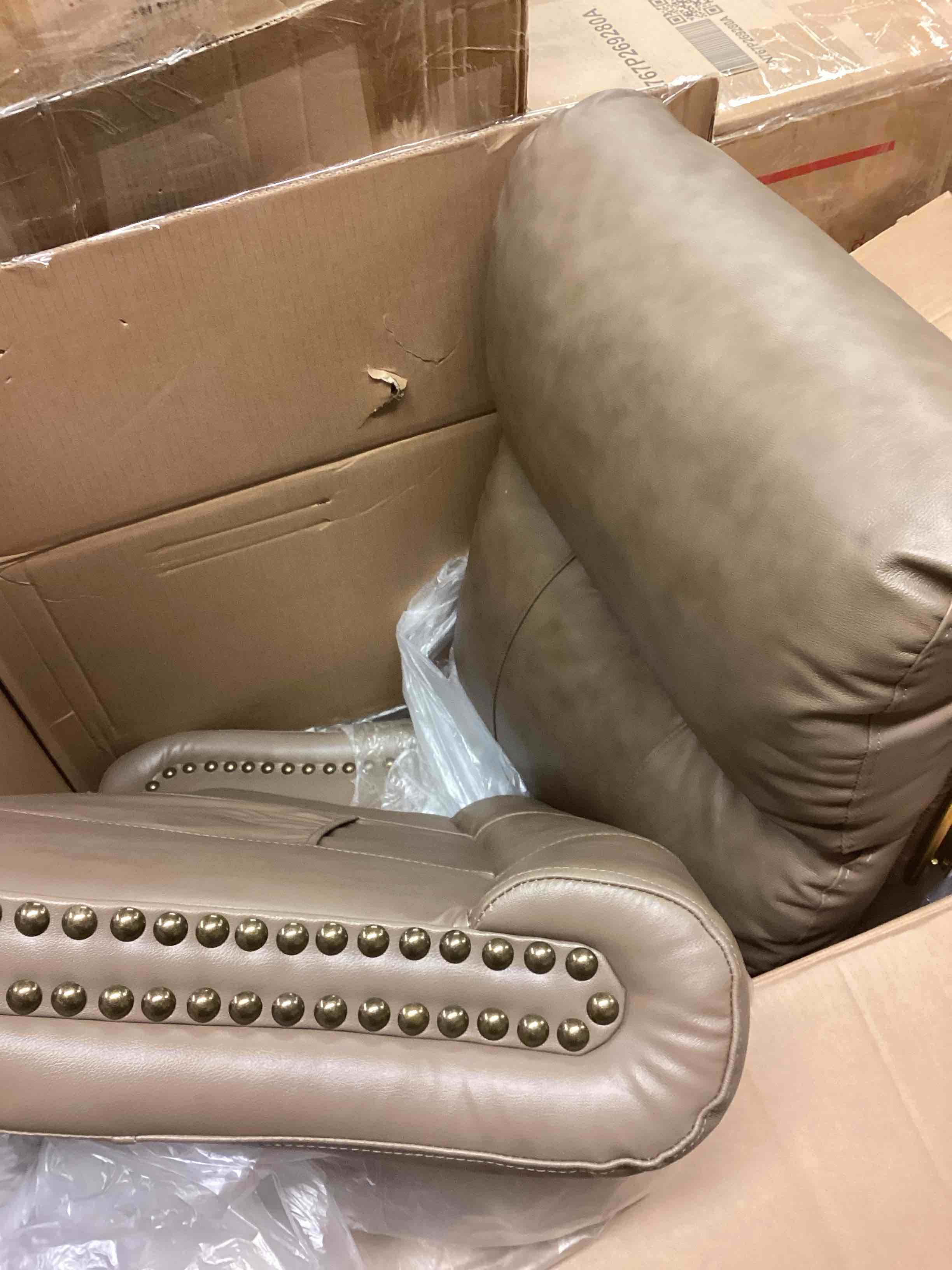 Condition photo showing As Is for reclining faux leather chair (incomplete one box of two only) (model different from stock photo)