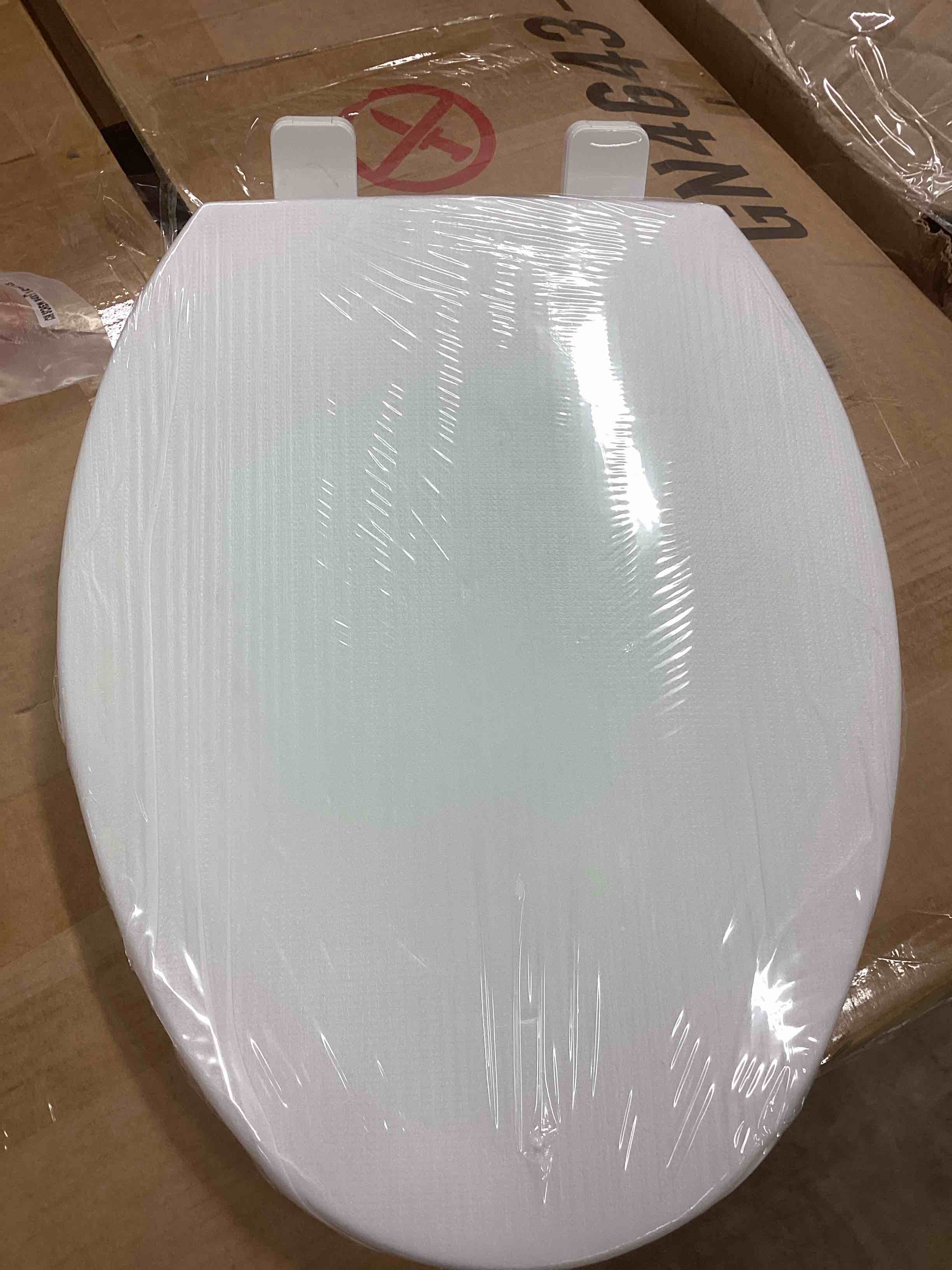 Condition photo showing New/Like New for elongated seat toilet 