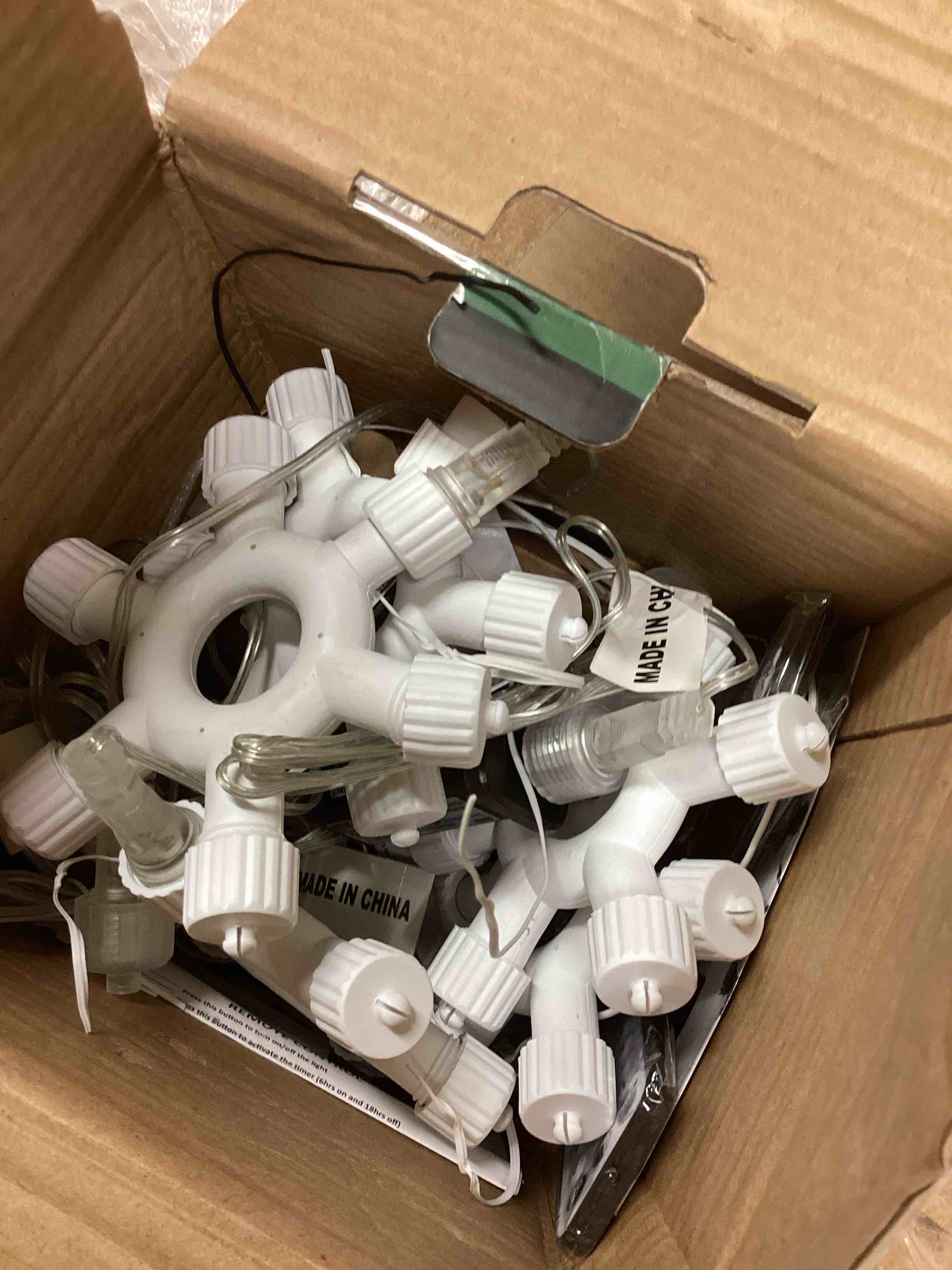 Condition photo showing As Is for christmas lights outdoor 250ft 750 led multicolor string lights with ring connector, 9 modes&timer remote, end to end conectable, ul listed, clear wire (incomplete only ring connector) 