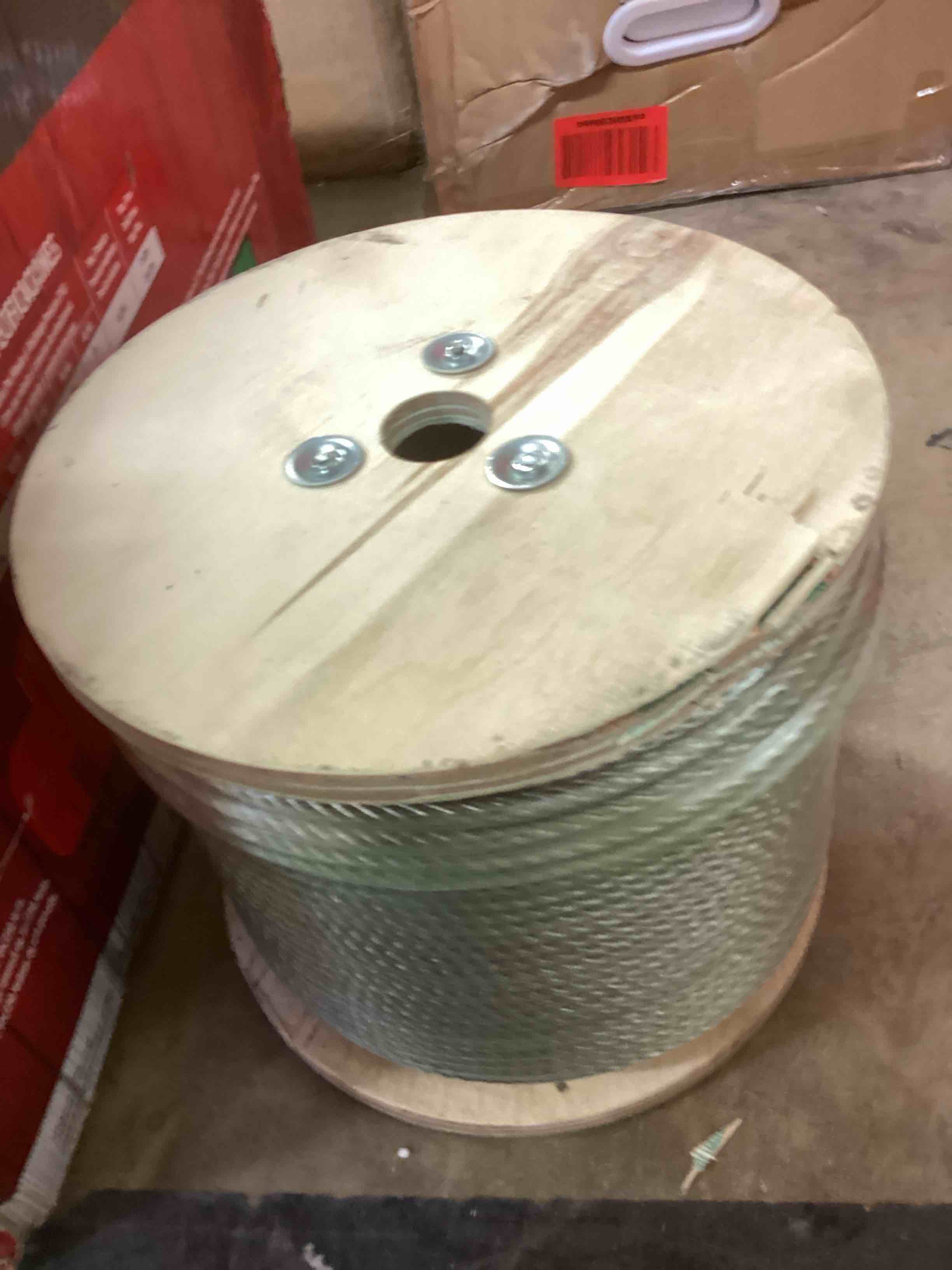 Condition photo showing New/Like New for 1/4" stainless steel cable,7x19 strand aircraft wire rope,cable for heavy duty applications,zip iine and outdoor pulley cables,deck railing, with gloves,breaking strength 6400 ibs,600ft