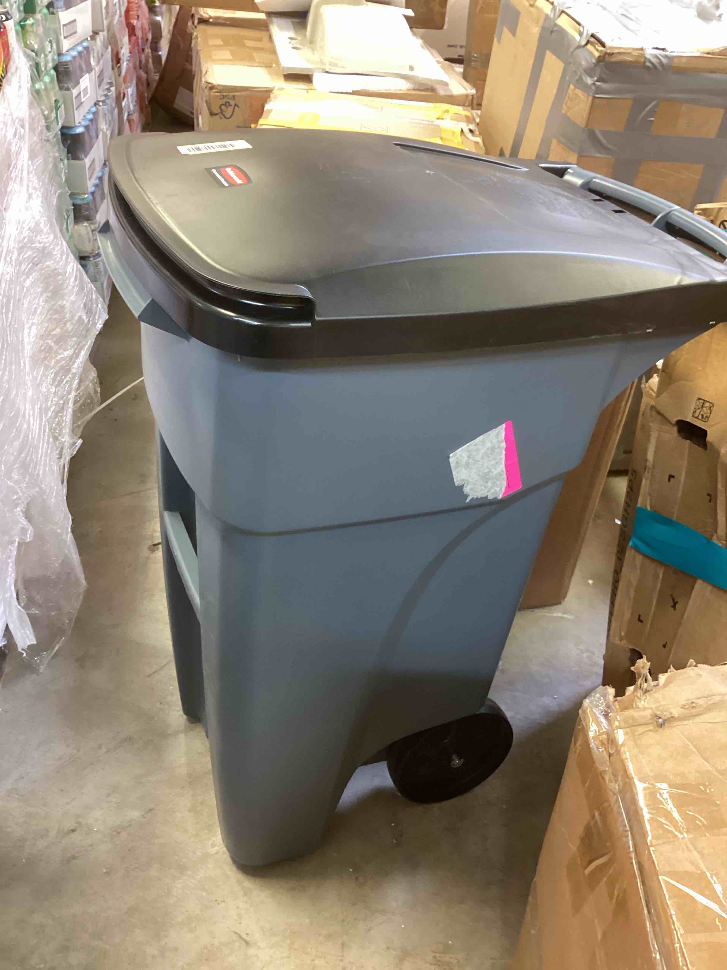 Condition photo showing As Is for rubbermaid commercial brute rollout heavy-duty waste container in gray.