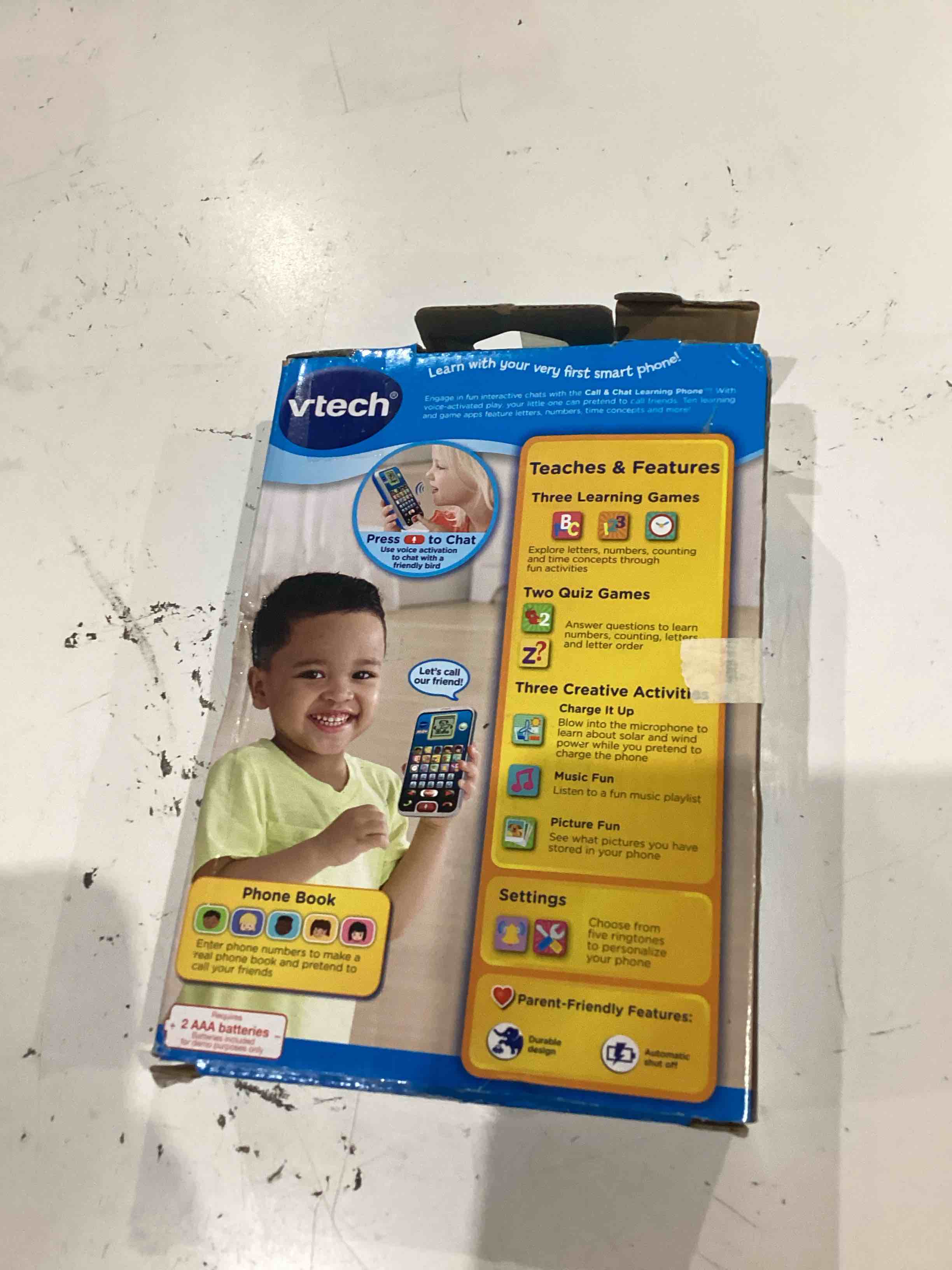 Condition photo showing As Is for vtech call and chat learning phone, black black standard packaging