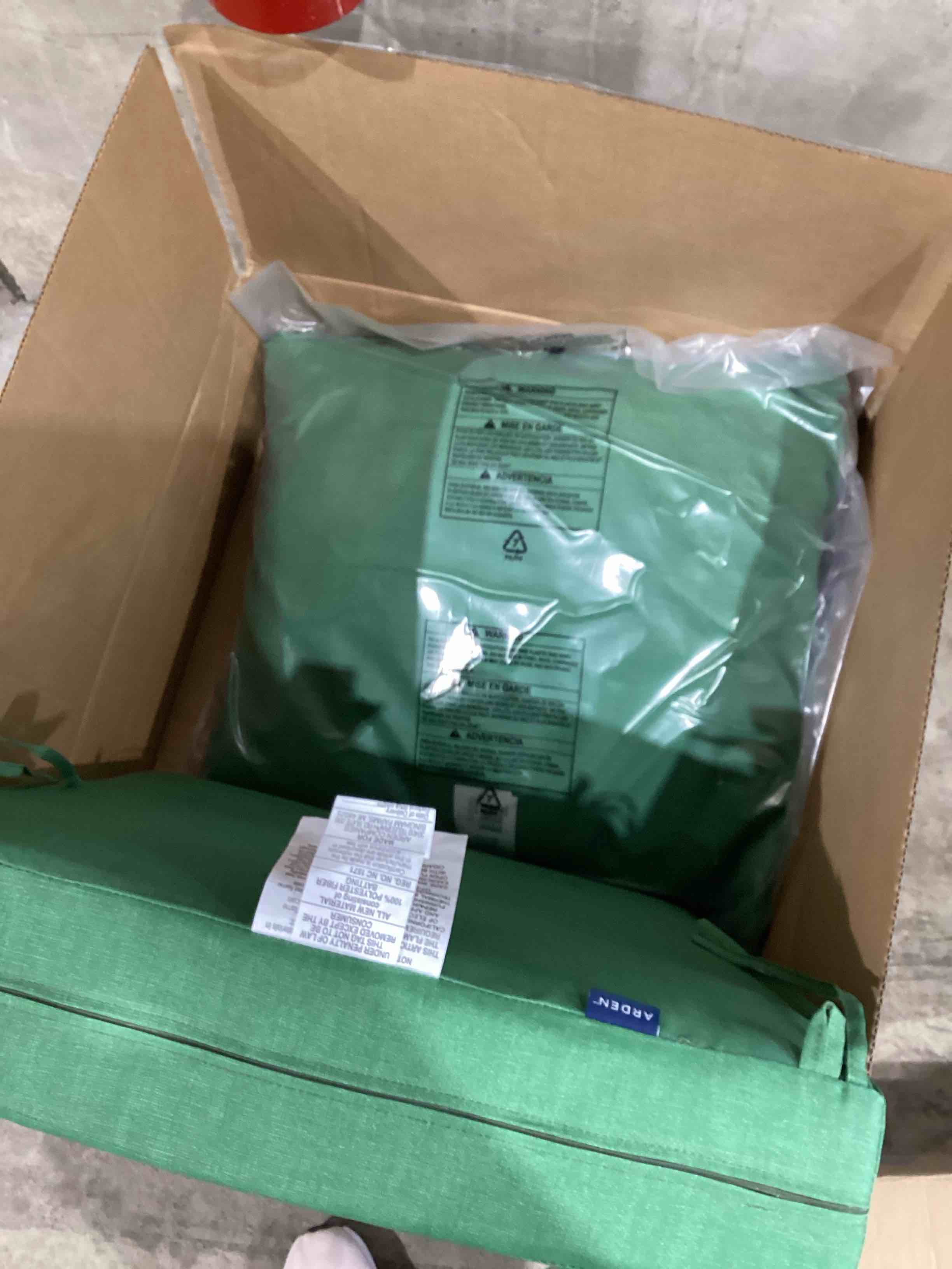 set of green seat cushions 