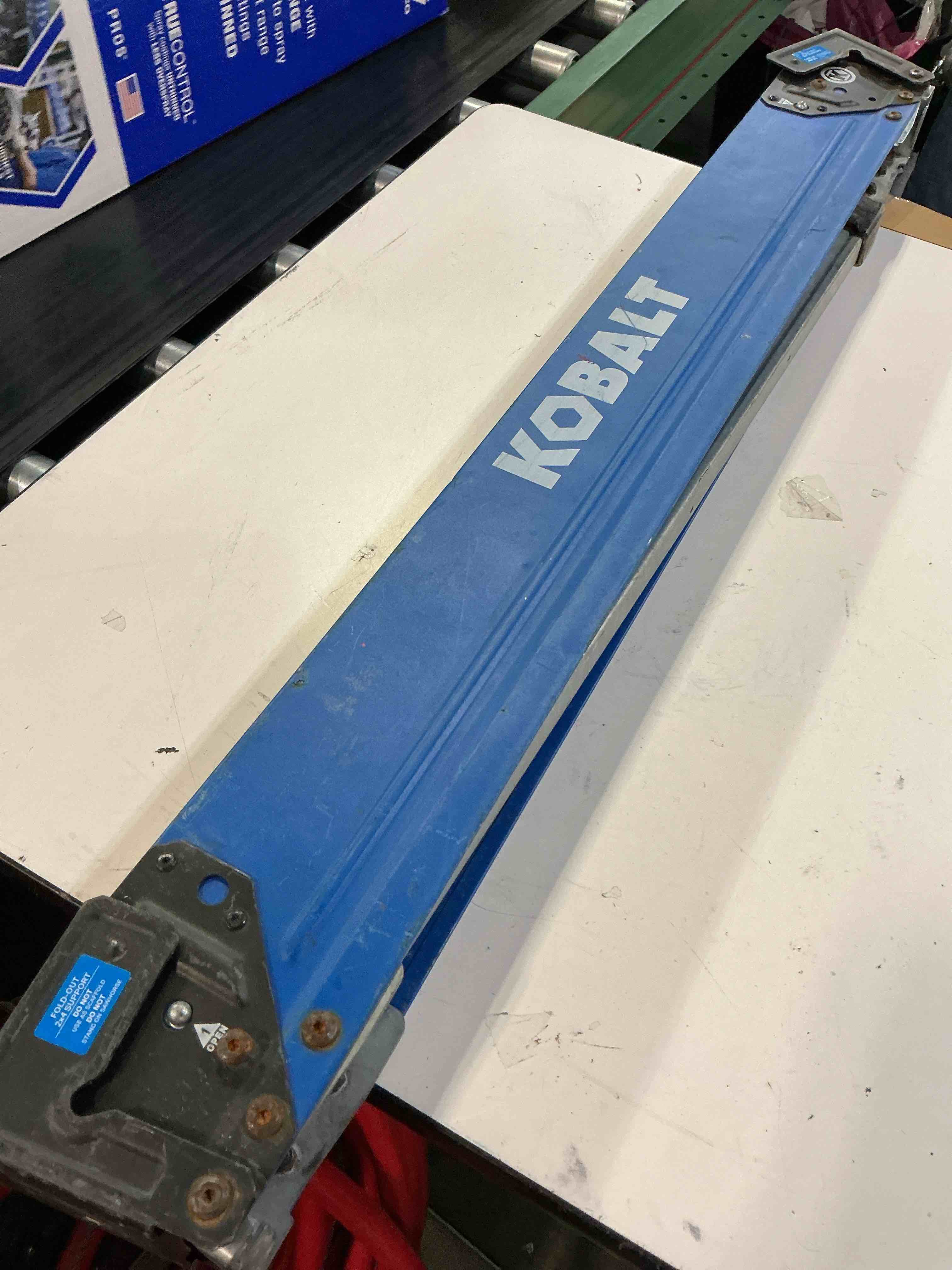 Condition photo showing As Is for kobalt 42-in w x 32-in h adjustable steel saw horse ( 1100-lb capacity)