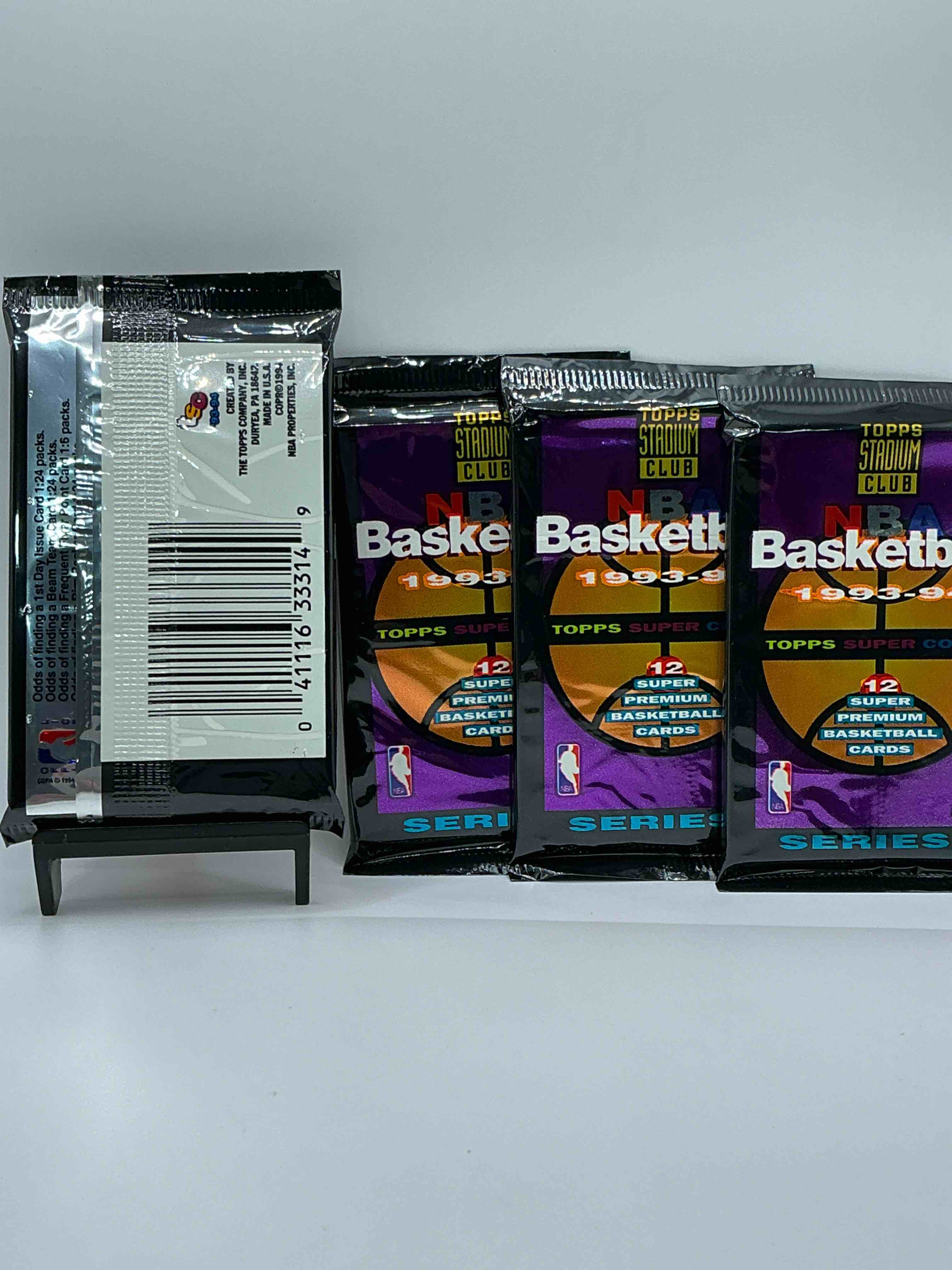 Condition photo showing New/Like New for nba bonanzal 1993- 94 topps stadium club series 2 basketball packs! 12 premium basketball cards in each packl search for legends & rookies alikel look for michael jordan, shag o'nell, hakeem olajuwon & more ist day issue cards, frequent flyer cards, members only cards & rookies from hardaway & webber! possible pippen, magic, jordan, robinson, shaq, olajuwon, ewing & so much more!