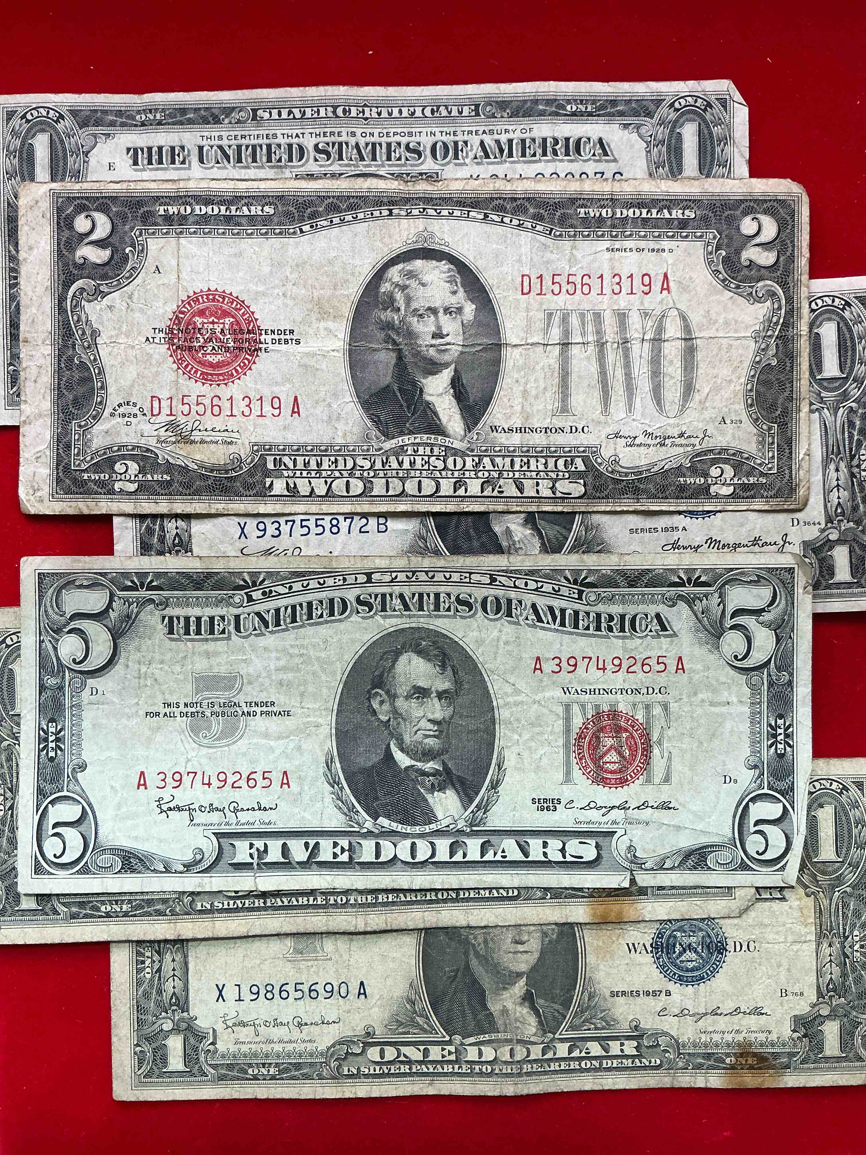 rare american dollar bills! red seal five dollar bill & red seal two dollar bill, along with silver certificates! five dollar bill ultra rare & in good condition, red seal two dollar bill in good condition & silver certificates produced from 1878 to 1964 & are still considered legal tender at face value. here are gorgeous, circulated 1935 & 1957 u.s. one dollar silver certificate, with highly collectible "blue seal!* own an awesome piece of history! american dollar lot! 