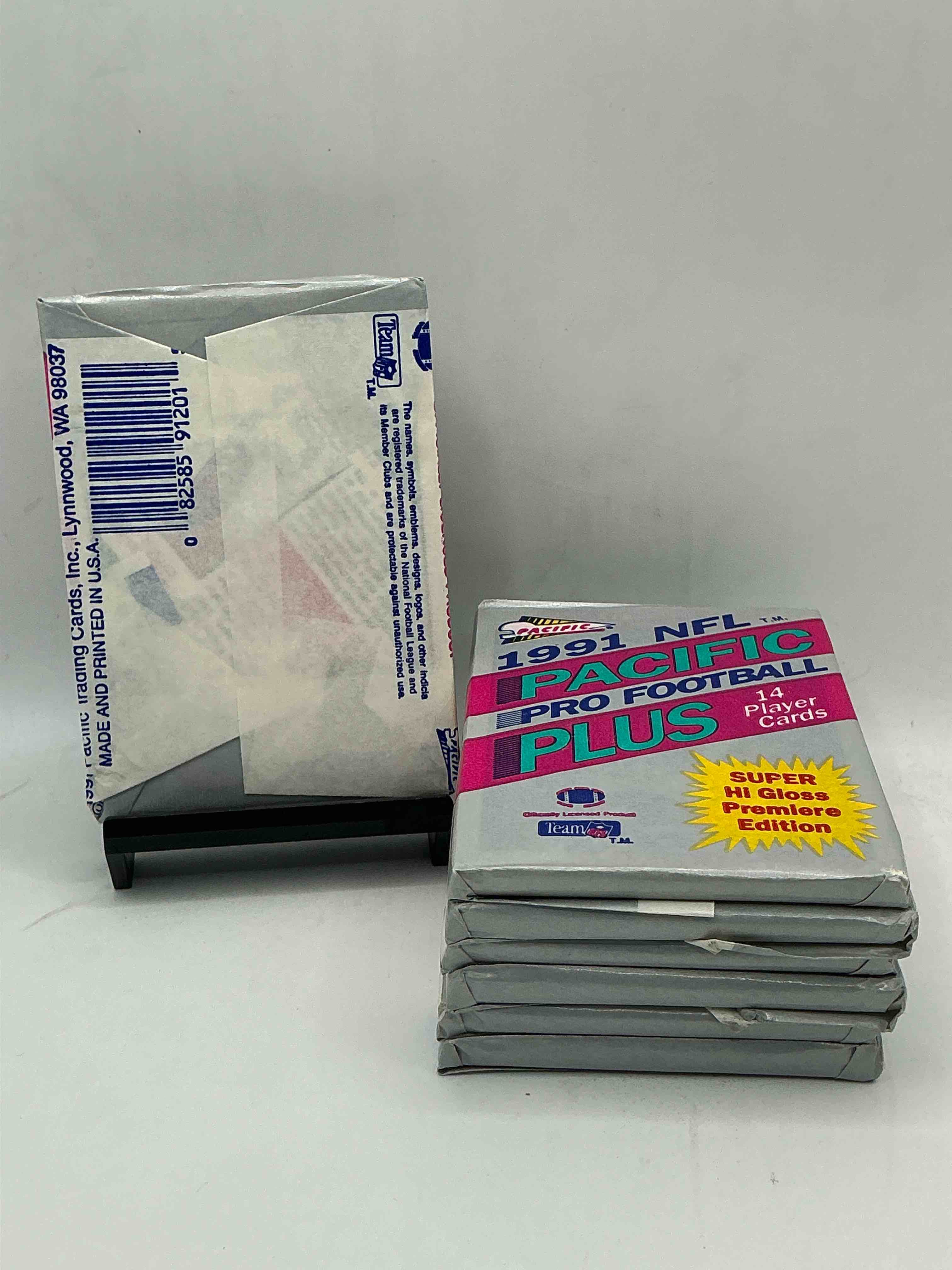 Condition photo showing New/Like New for 1991 pacific football premiere edition, something you hardly ever see! pacific footbell sealed card pack, direct from original retail case. search for brett favre rookie, barry sanders, jerry rice & so much more! hard to find!
