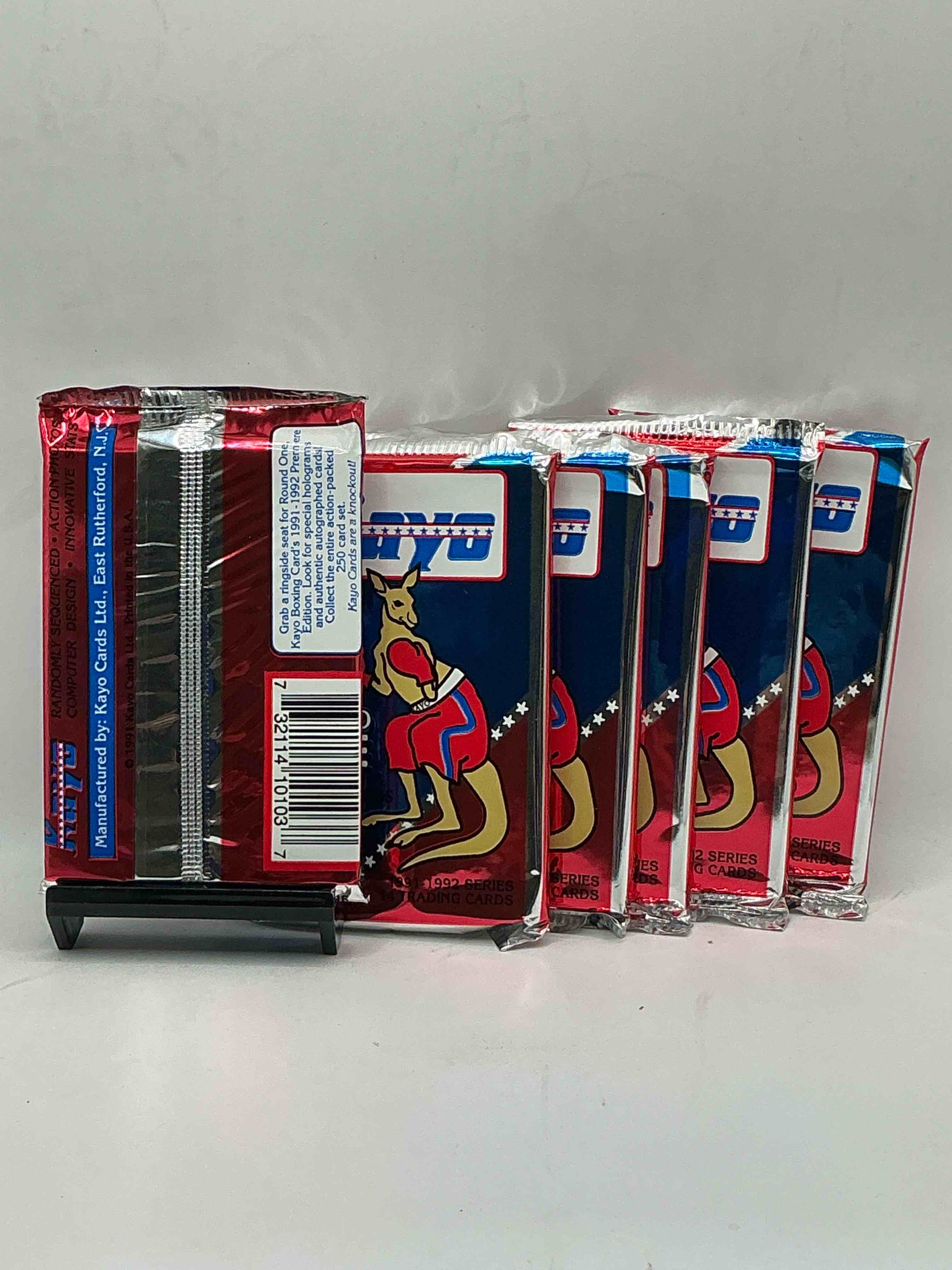 Condition photo showing New/Like New for 1991-92 kayo round one boxing cards! 14 cards per pack! look for roy jones jr, lennox lewis, james toney & more! beautiful packs!