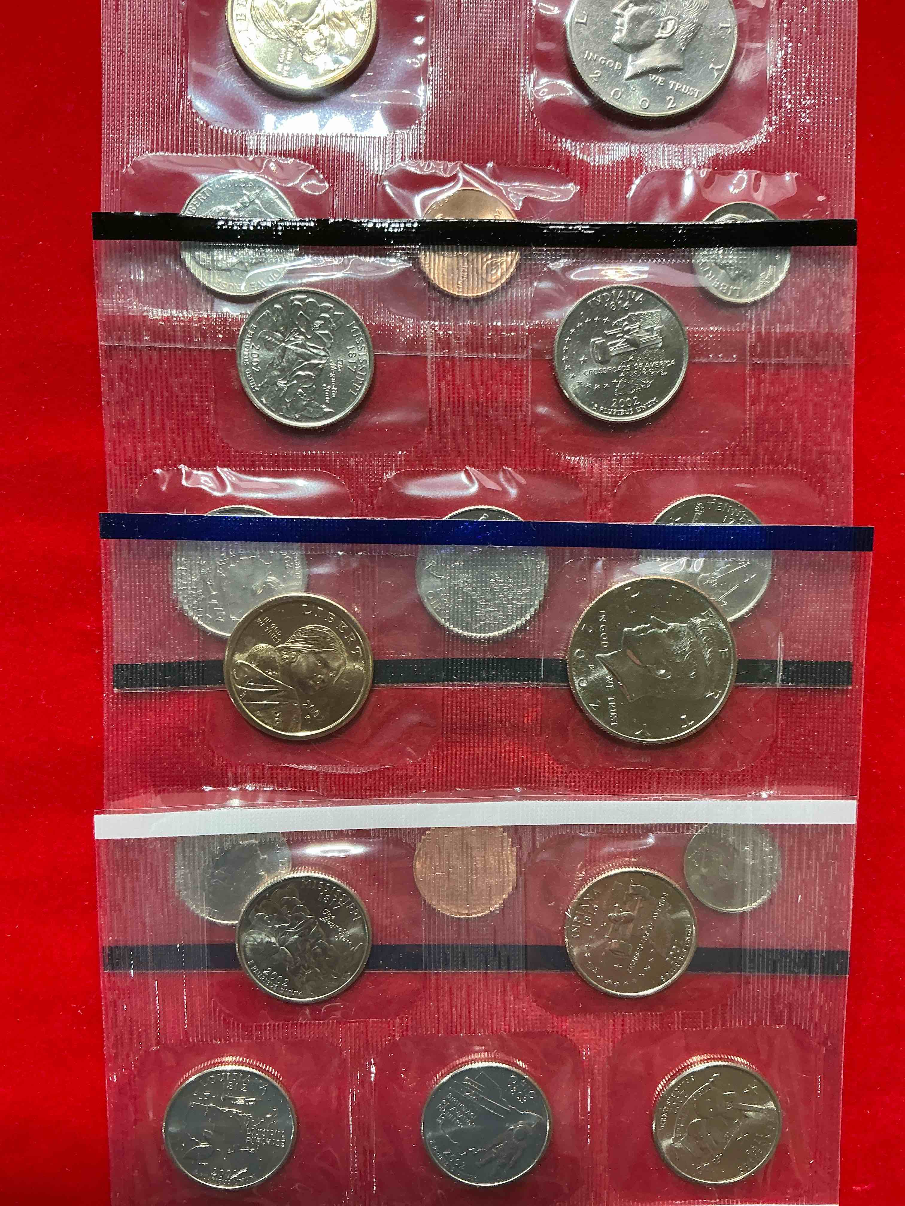 Condition photo showing New/Like New for 2002 uncirculated mint coins! 20 coins from philadelphia & denver! 20 coin uncirculated lot, with state quarters, nickels, half dollars, dimes, pennies & more! uncirculated coin craziness!