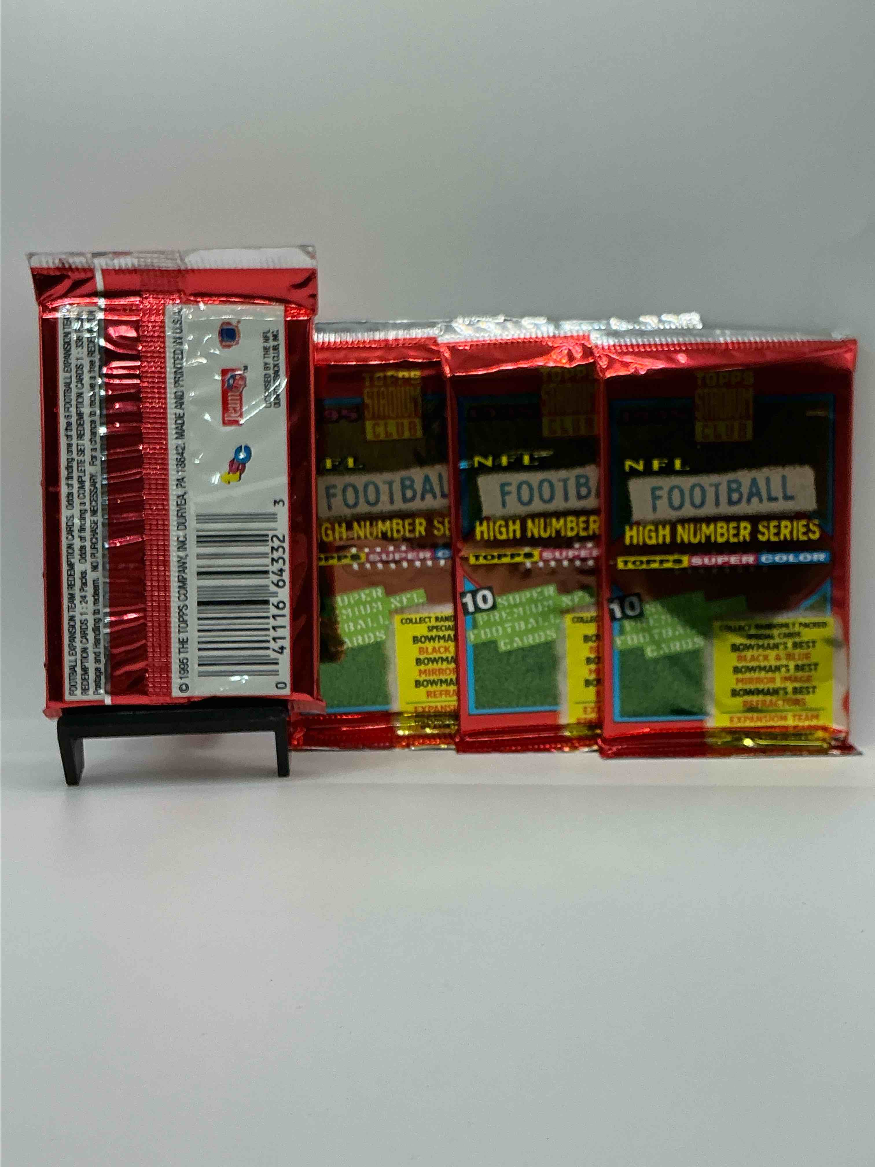 Condition photo showing New/Like New for 1995 nfl football high number series topps stadium club super color! 10 super nfl football cards! collect randomly packed cards, bowman’s best, black & blue, mirror image, refractors & more! rare packs!