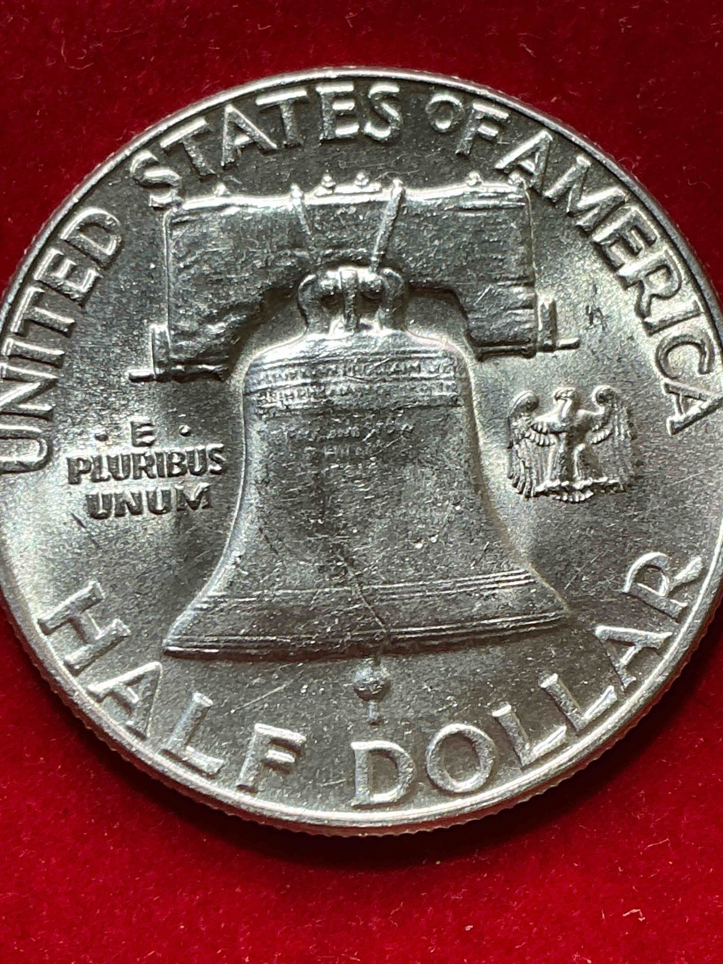 Condition photo showing New/Like New for ben franklin silver! pre 1965 silver u.s. half dollar coin! before 1965 american half dollars were actually silver, here is a rare 1955version in good condition! great for investing in precious metals! these heavy half dollars were minted at 90% silver and 10% copper, giving them a net weight of .36169 ounces of pure silver per coin! very rare in this great condition!