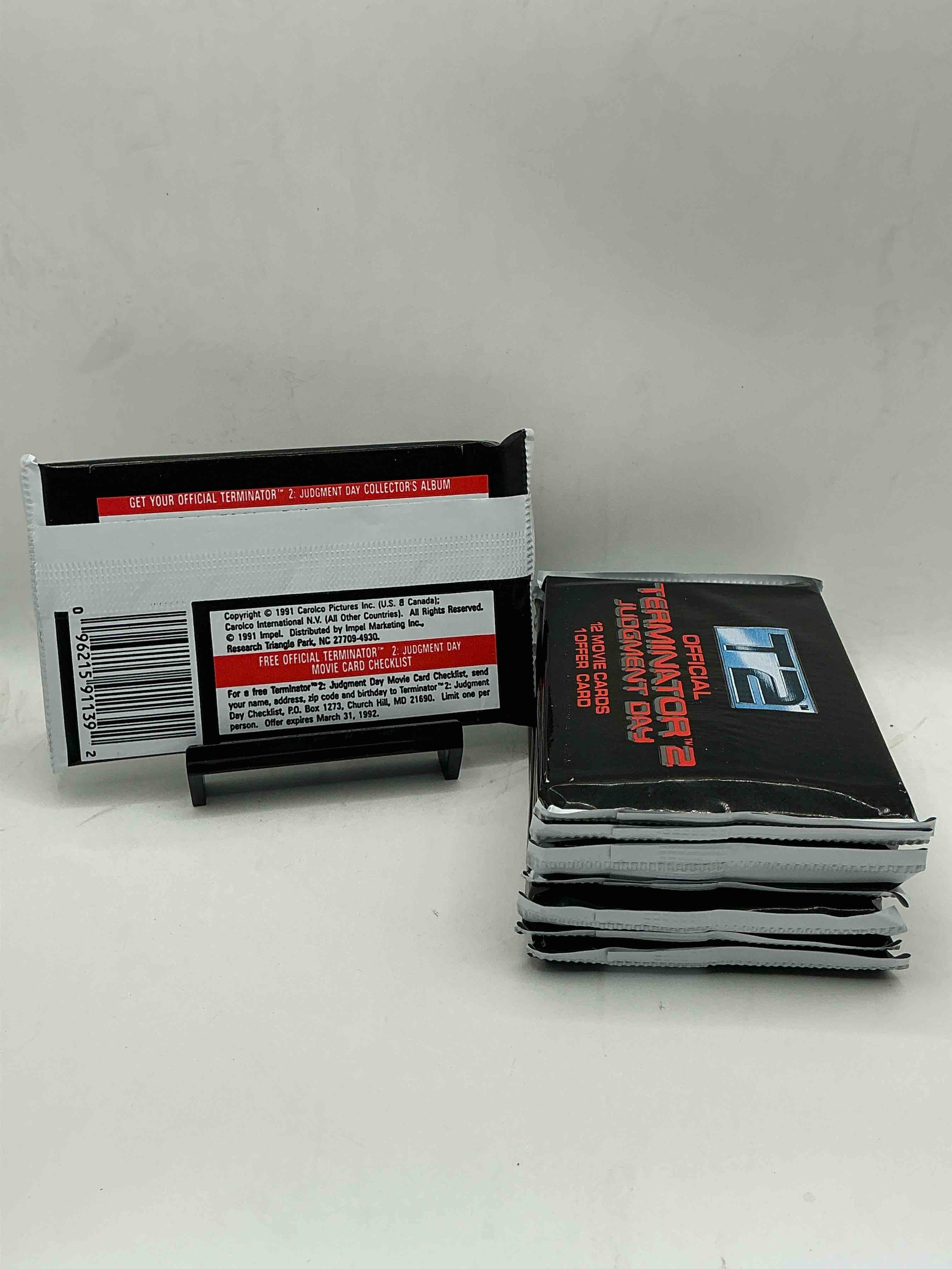 Condition photo showing New/Like New for terminator 2 packs! direct from box unopened 1991 terminator 2 movie card packs, 12 cards per pack! pack galore! check out these rare movie cards from 1991!