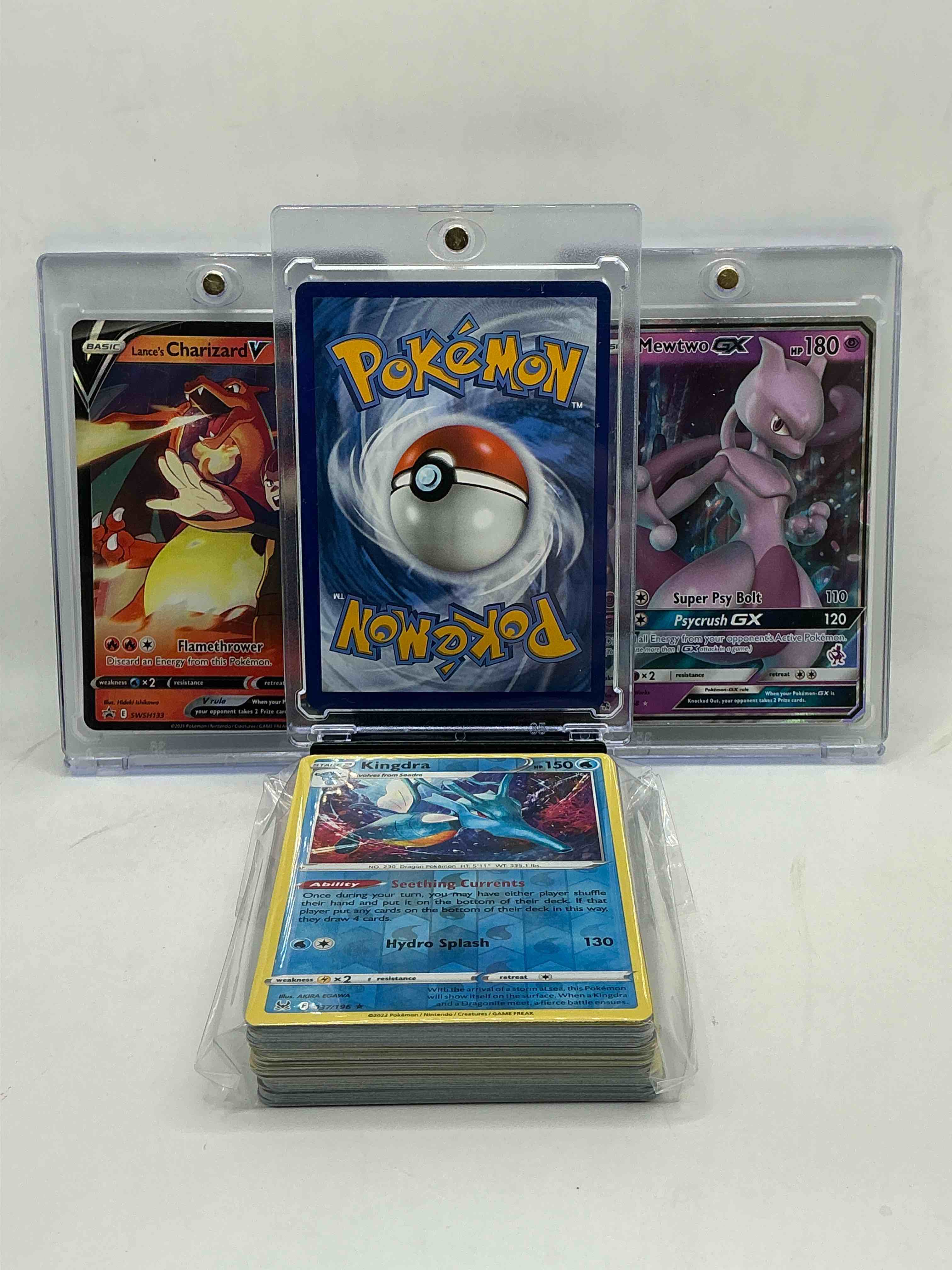 Condition photo showing New/Like New for flying pikachu vmax! lance’s charizard v! mewtwo gx! along with 50 other pokémon heroes, holos, legends & commons- including holographic cards, stage 2 cards, holos in all forms & more! also includes 36 non holo common/ uncommon basic & first stage cards trainers & energy too! perfect set for collectors & enthusiasts!