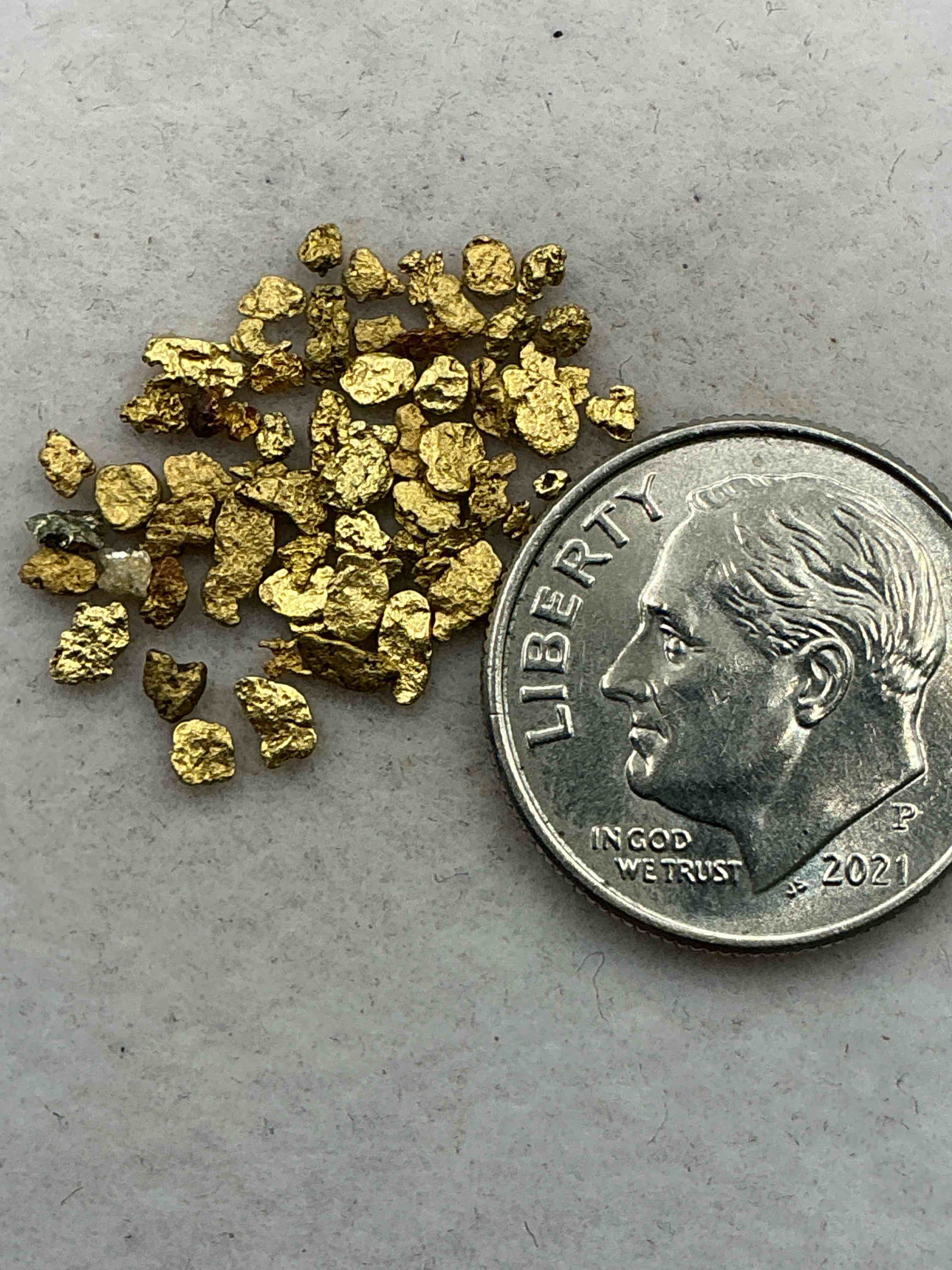 Condition photo showing Good Condition for genuine gold nuggets! approximately 1 gram of prospected gold nuggets! gold nuggets fresh from prospecting north carolina mountains, total weight of all nuggets is approximately 1 gram! these gold nuggets test at between approx 22-24 karat. gold in raw, prospected form is extremely hard to find & much rarer than any refined form. get in on the gold craze... gold has increased in value over 40% since 2025! u.s. dime for size reference only (not included). case in image included. own genuine, gold nuggets!