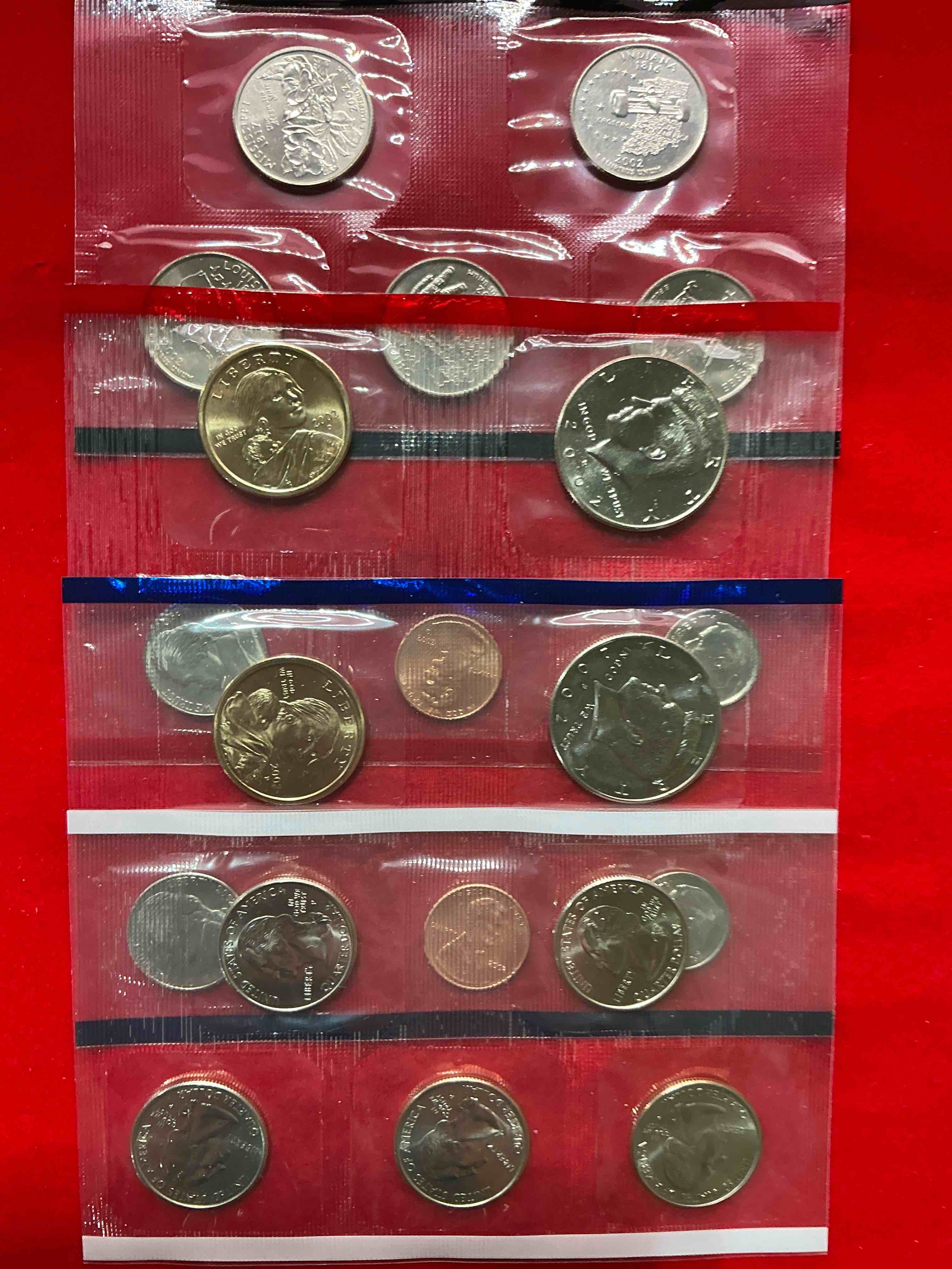 Condition photo showing New/Like New for 2002 uncirculated mint coins! 20 coins from philadelphia & denver! 20 coin uncirculated lot, with state quarters, nickels, half dollars, dimes, pennies & more! uncirculated coin craziness!