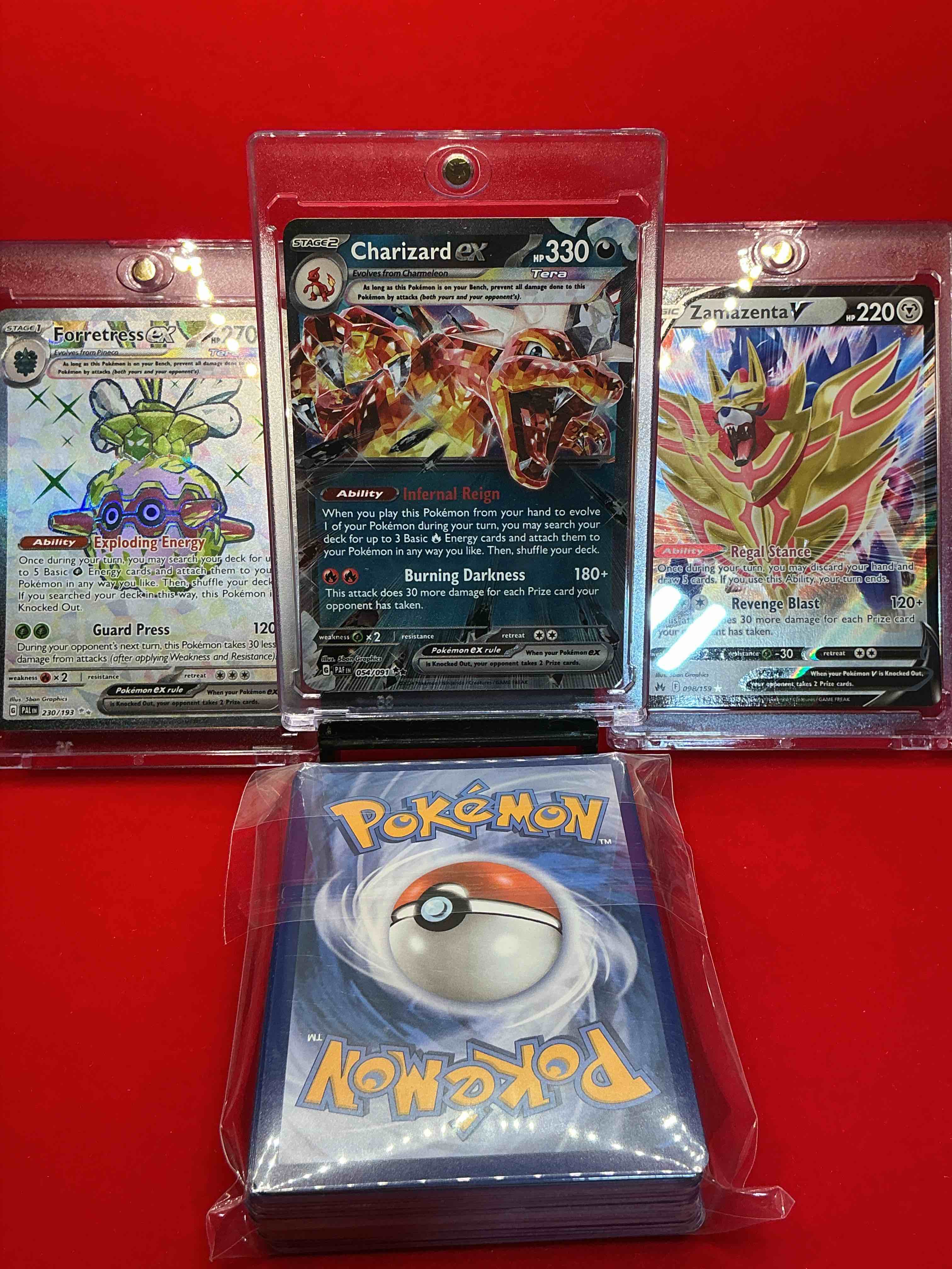 Condition photo showing New/Like New for charizard ex! zamazenta v! forretressex! along with 50 other pokémon heroes, holos, legends & commons- including holographic cards, stage 2 cards, holos in all forms & more! also includes 36 non holo common/ uncommon basic & first stage cards trainers & energy too! perfect set for collectors & enthusiasts!