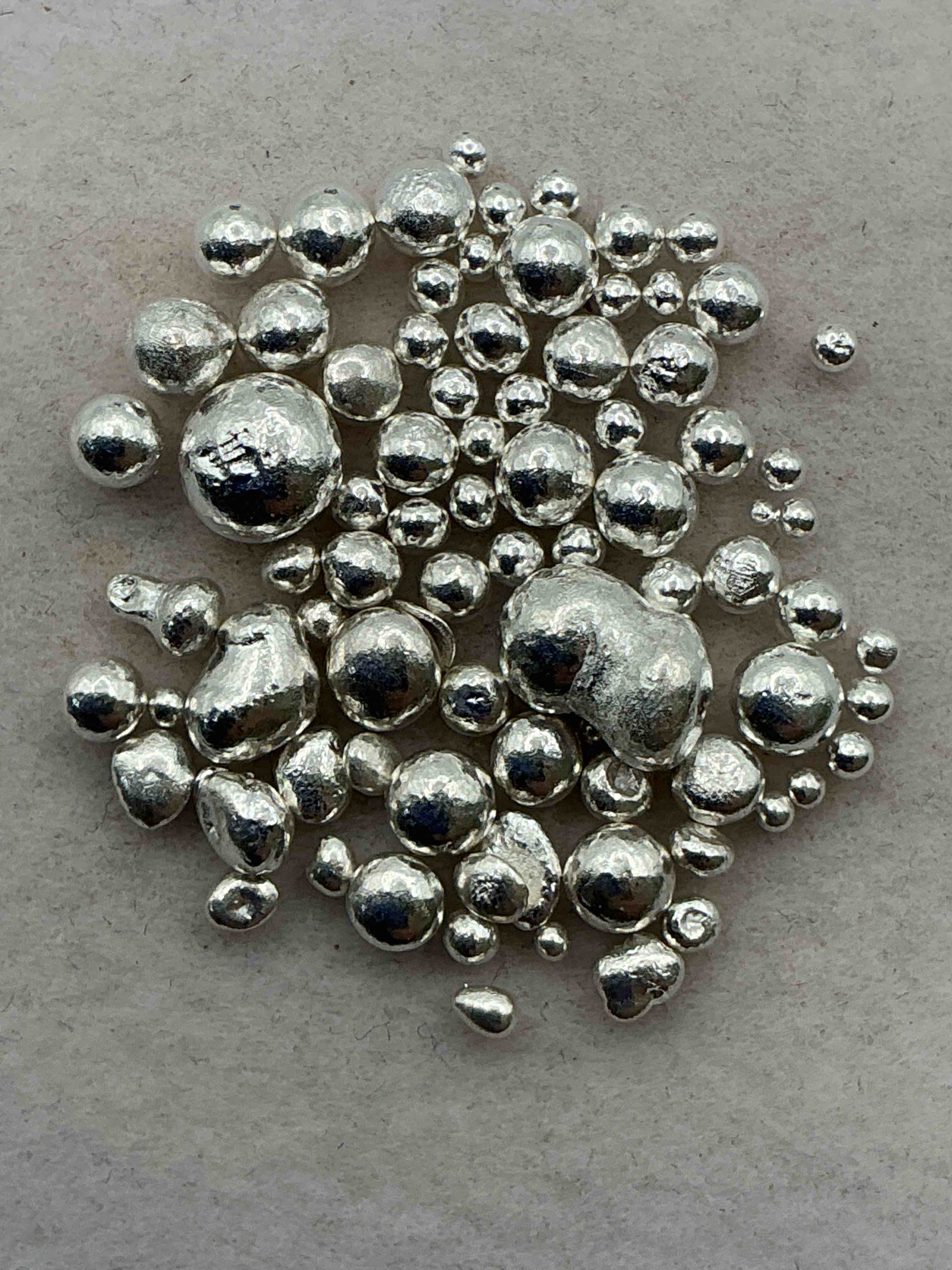 silver nuggets! .999 us fine silver, in small nugget form! total weight of all nuggets in lot approximately 9 grams, bid is per nugget! a cool way to invest in fine us silver! includes collector capsule!