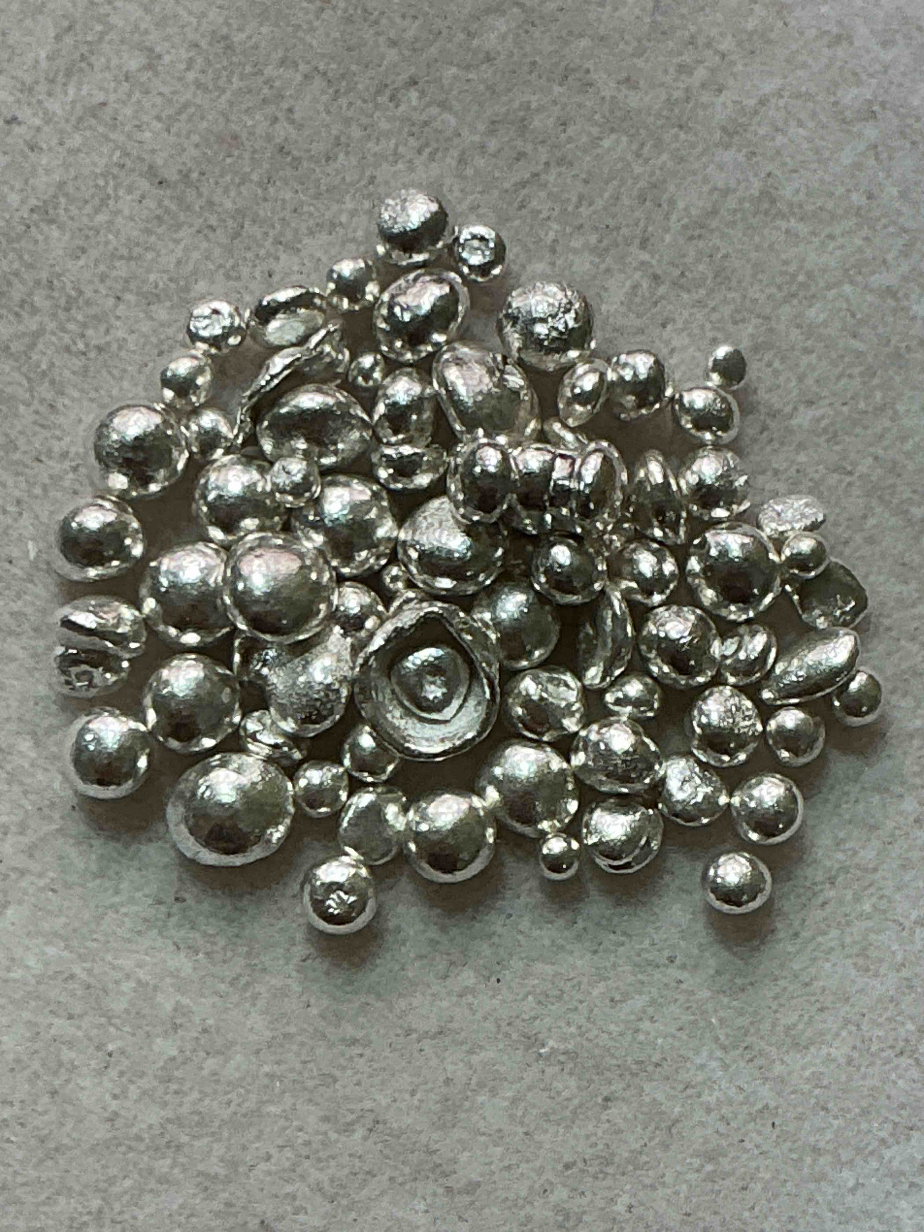 silver nuggets! .999 us fine silver, in small nugget form! total weight of all nuggets in lot approximately 9 grams, bid is per nugget! a cool way to invest in fine us silver! includes collector capsule!