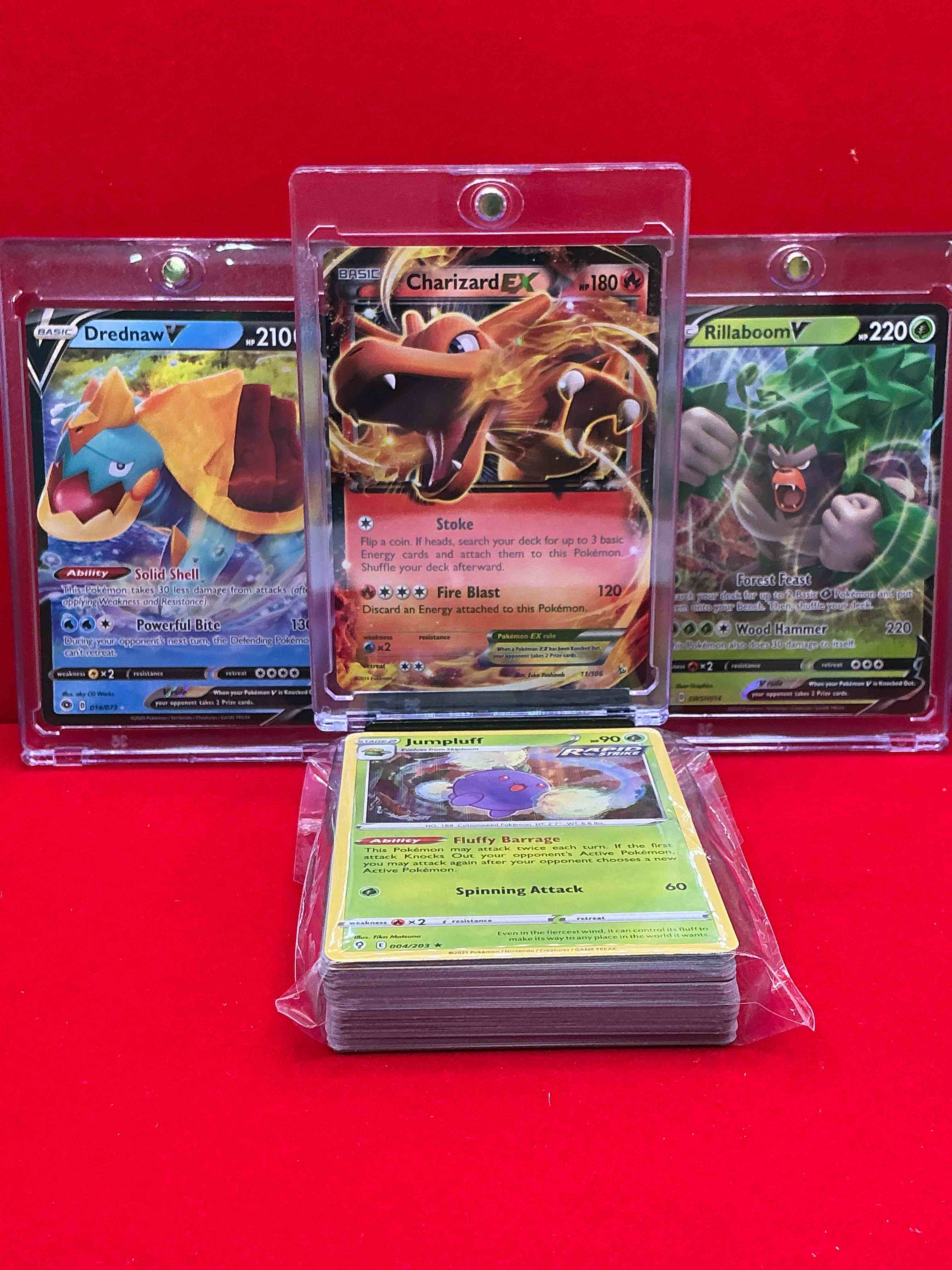 Condition photo showing New/Like New for charizard ex, rillaboom v, drednaw v! pokémon palooza! along with 50 other pokémon heroes, holos, legends & commons- including holographic cards, stage 2 cards, holos in all forms & more! also includes 36 non holo common/ uncommon basic & first stage cards trainers & energy too! perfect set for collectors & enthusiasts!