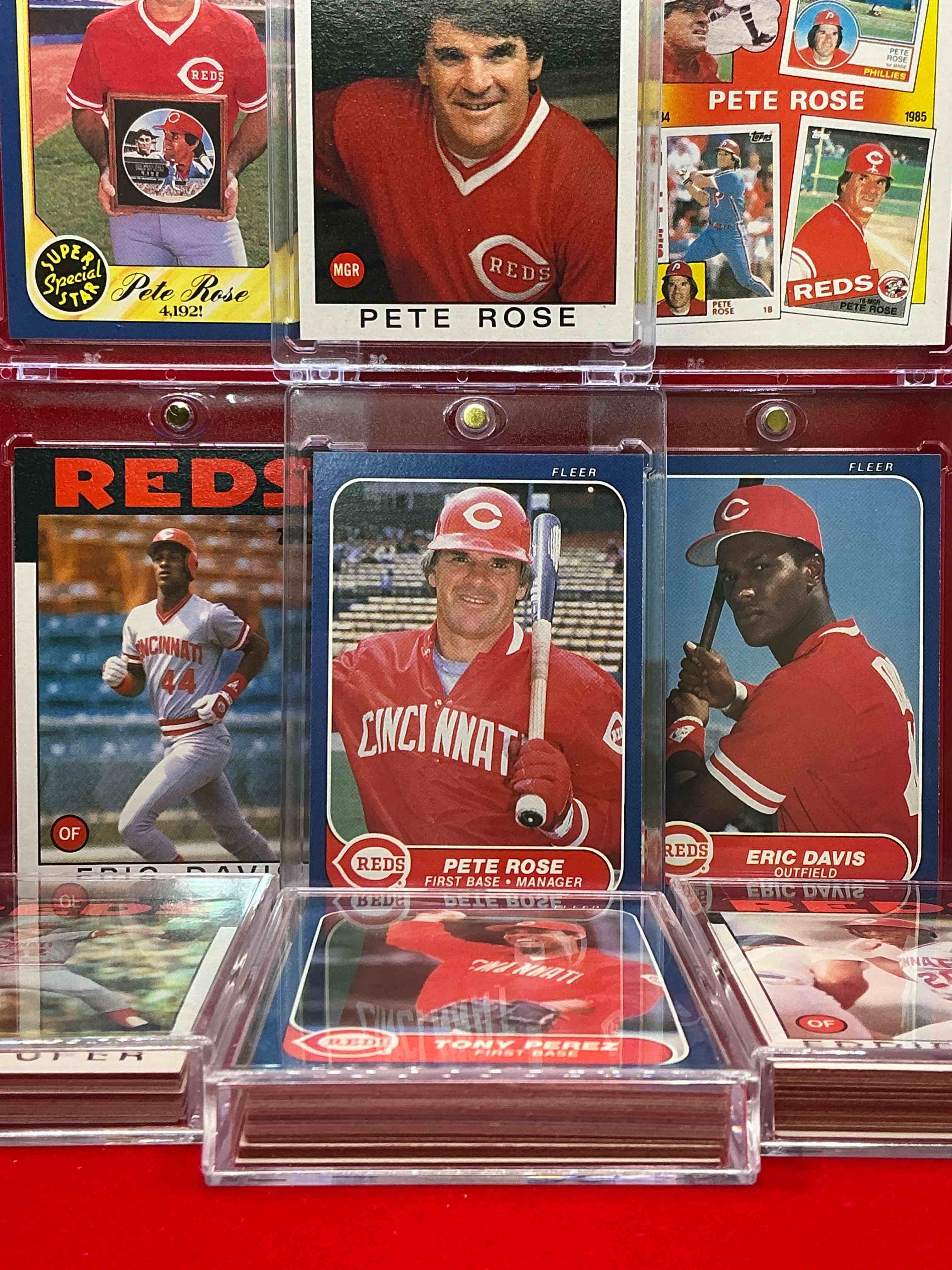 Condition photo showing New/Like New for 1986 reds! 1986 topps reds cards & 1986 fleer reds cards! multiple pete rose cards, eric davis topps & fleer, tony perez, pete rose, eddie milner & more! 63 cards, a combo of both years!