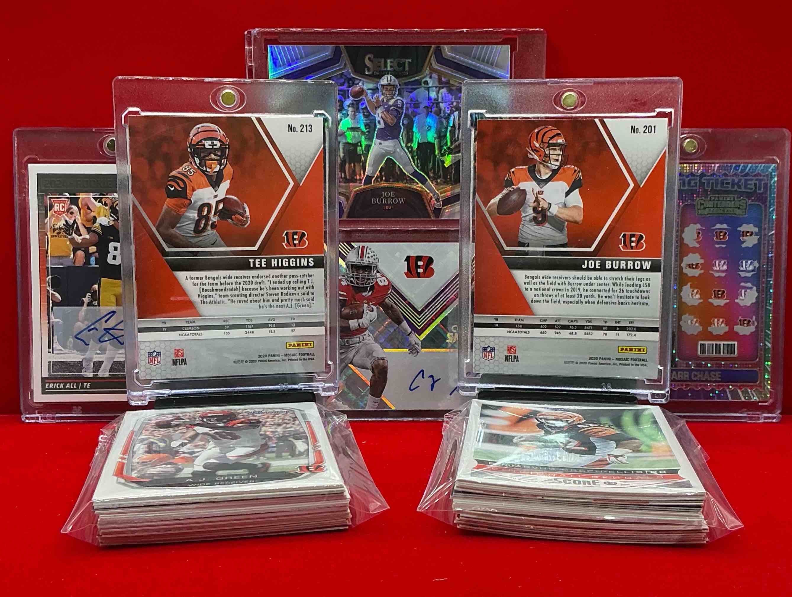 Condition photo showing New/Like New for autographs, numbered cards, rookies & more! bengals & legends galore! tee higgins mosaic rookie, joe burrow rookie, winning ticket chase, erick all auto rookie, silver select, corey smith /25 elite auto & more! commons & legends, vintage & new!