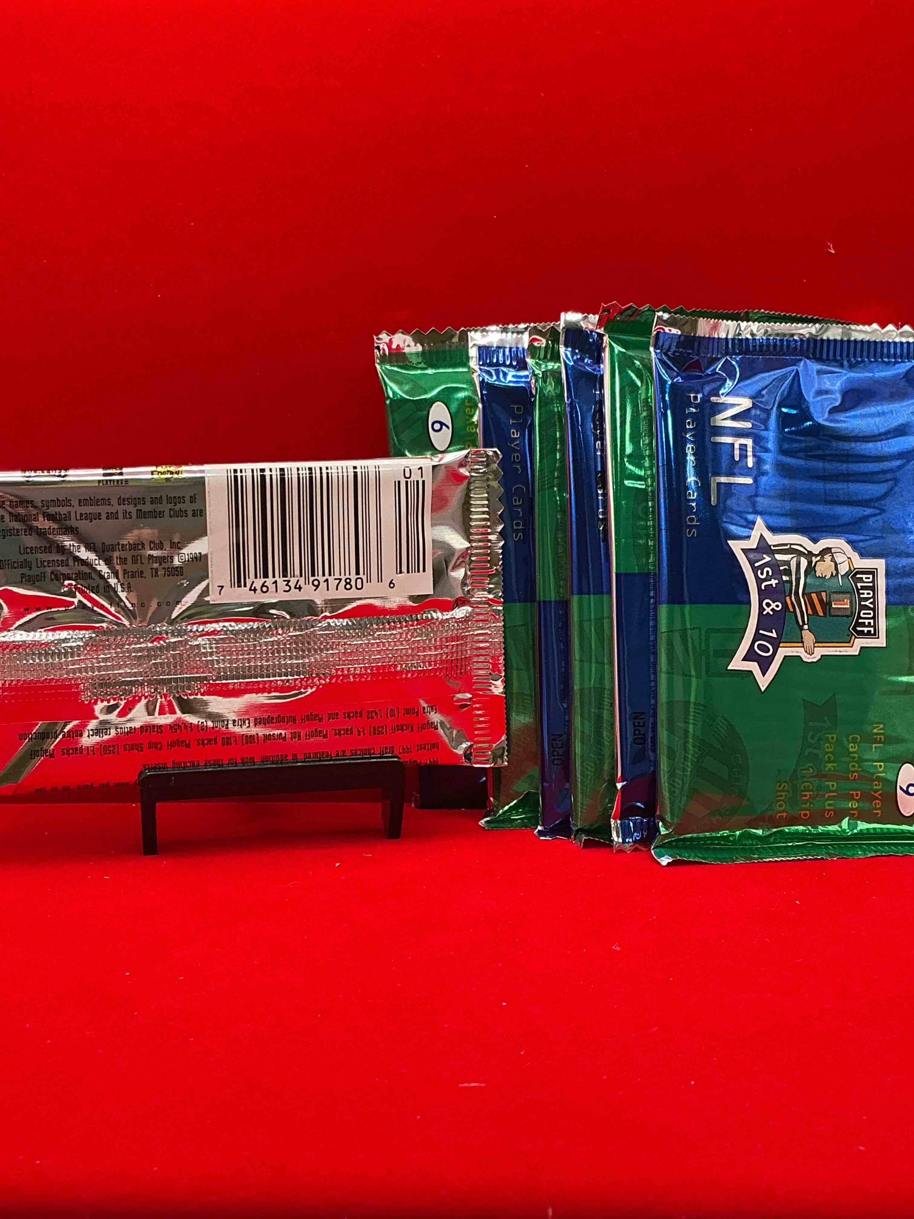 Condition photo showing New/Like New for 1997 playoff 1st & 10 nfl football packs! rare & super cool football packs, look for legends! 9 cards per pack & 1 chip shot! look for jerry rice, joe montana, john elway & more! wow!
