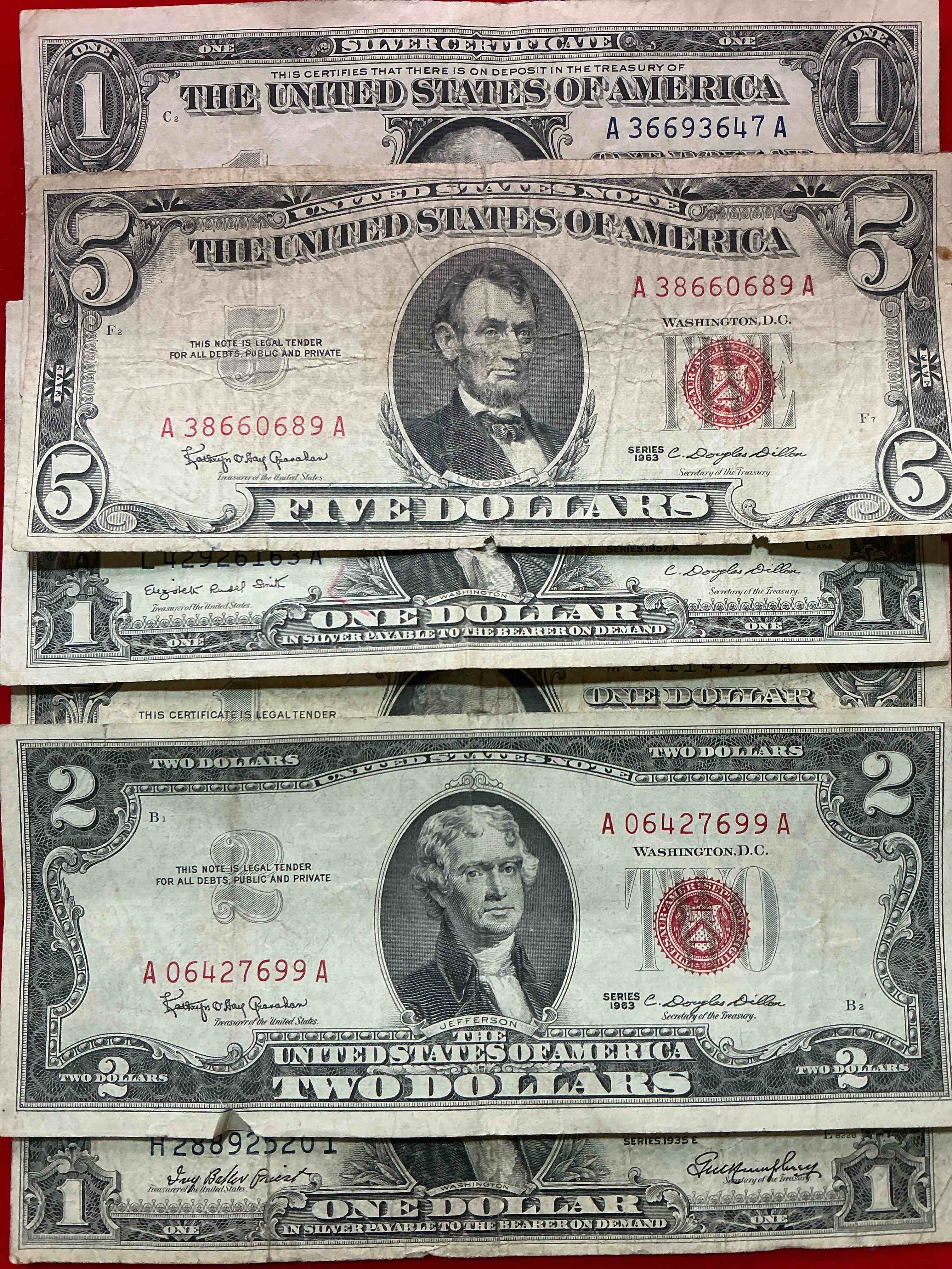 rare american dollar bills! red seal five dollar bill & red seal two dollar bill, along with silver certificates! five dollar bill ultra rare & in good condition, red seal two dollar bill in good condition & silver certificates produced from 1878 to 1964 & are still considered legal tender at face value. here are gorgeous, circulated 1935 & 1957 u.s. one dollar silver certificate, with highly collectible "blue seal!* own an awesome piece of history! american dollar lot!