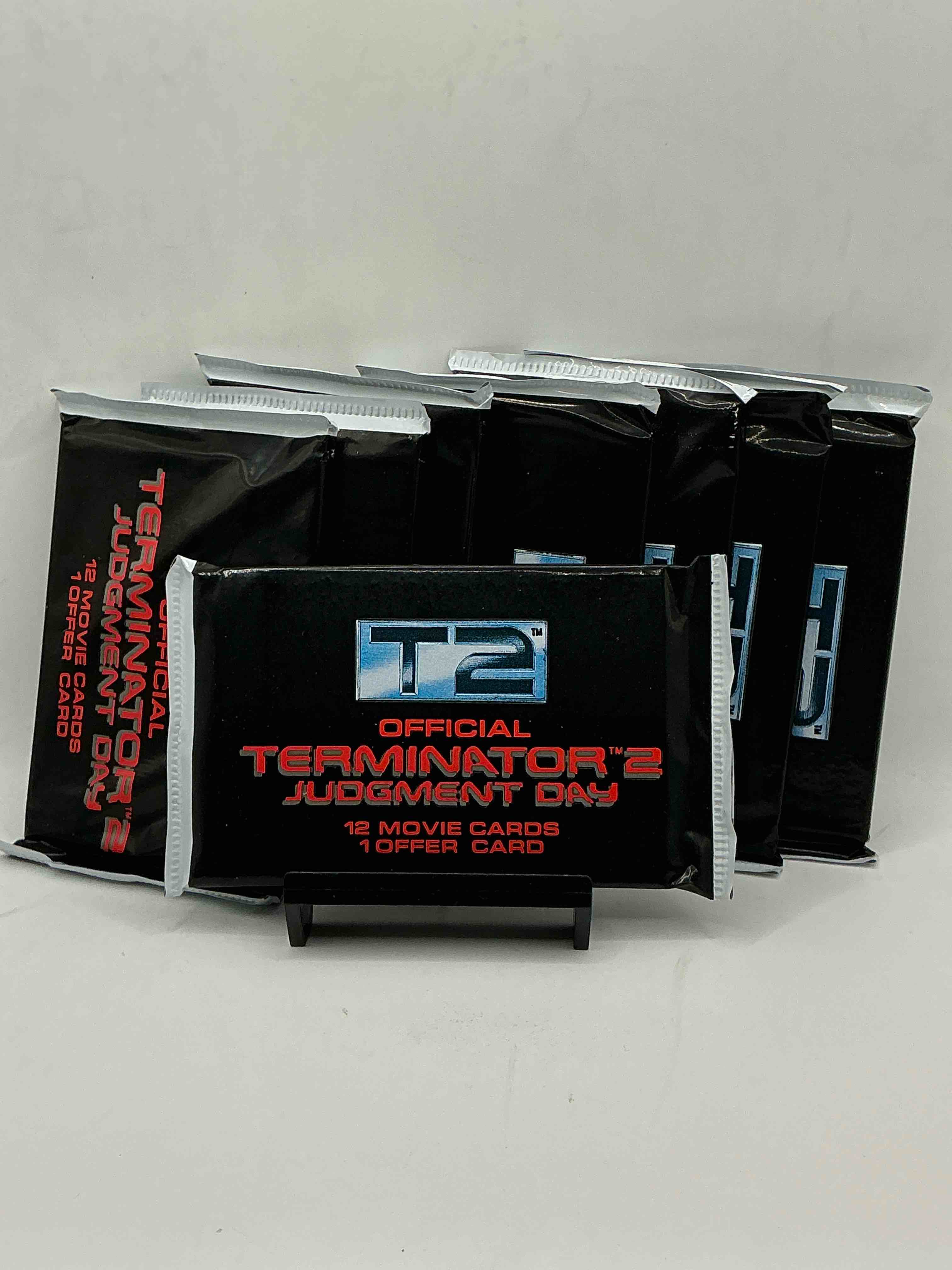 Condition photo showing New/Like New for terminator 2 packs! direct from box unopened 1991 terminator 2 movie card packs, 12 cards per pack! pack galore! check out these rare movie cards from 1991!
