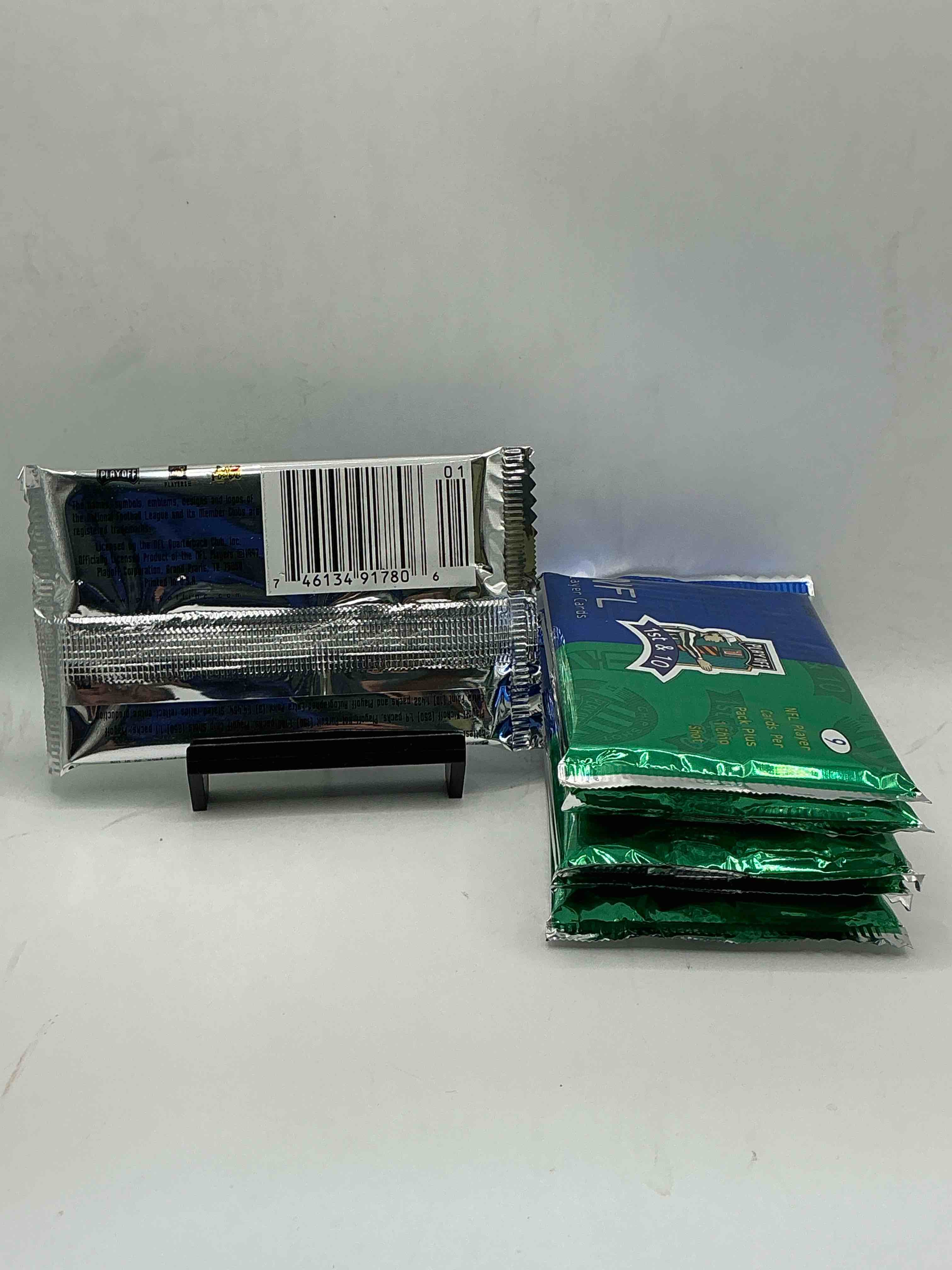 Condition photo showing New/Like New for 1997 playoff 1st & 10 nfl football packs! rare & super cool football packs, look for legends! 9 cards per pack & 1 chip shot! look for jerry rice, joe montana, john elway & more! wow!