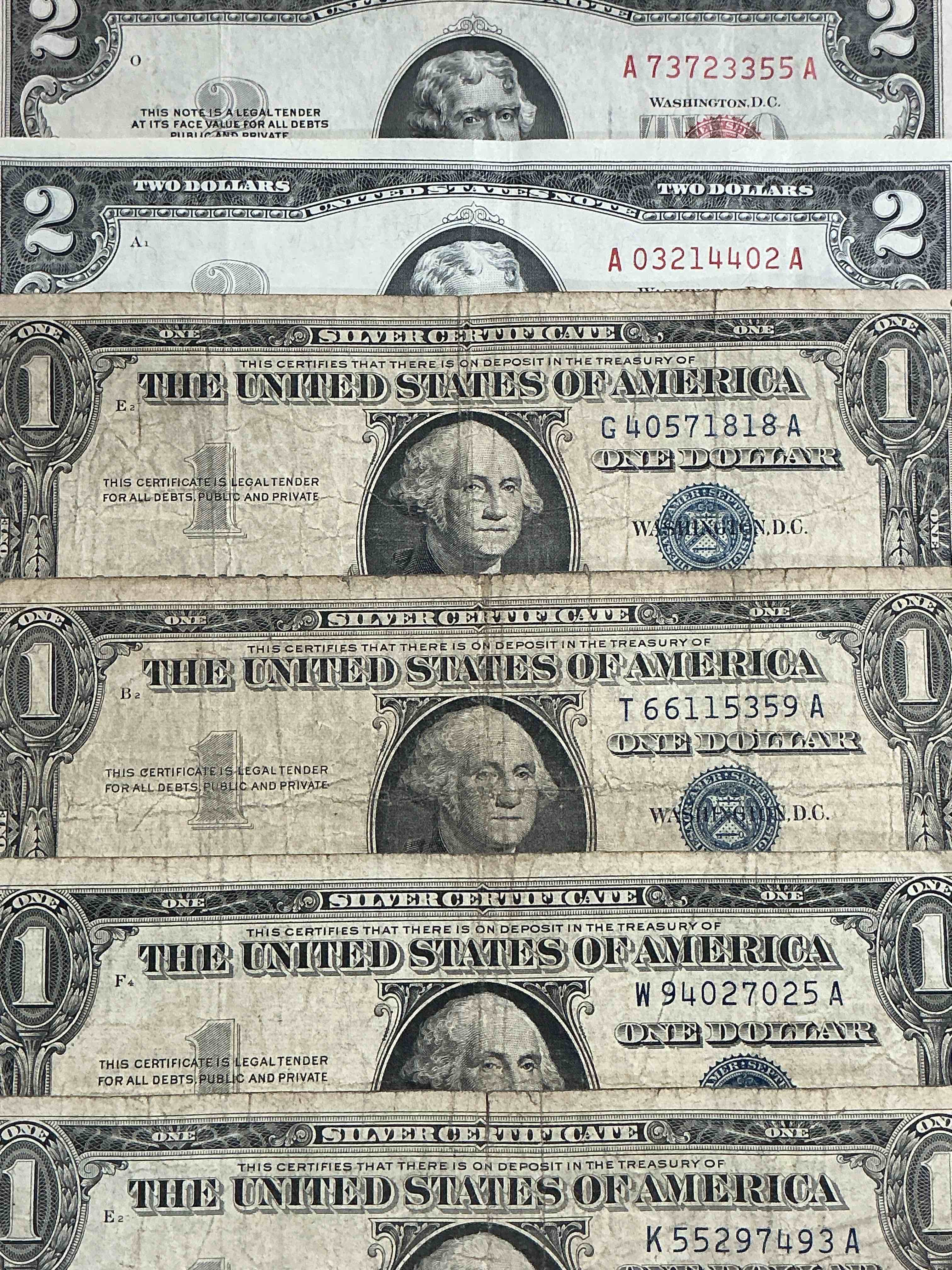 Condition photo showing Good Condition for rare american dollar bills! red seal two dollar bill, along with silver certificates! red seal two dollar bill in good condition & silver certificates produced from 1878 to 1964 & are still considered legal tender at face value. here are gorgeous, circulated 1935 & 1957 u.s. one dollar silver certificate, with highly collectible "blue seal!* own an awesome piece of history! american dollar lot!