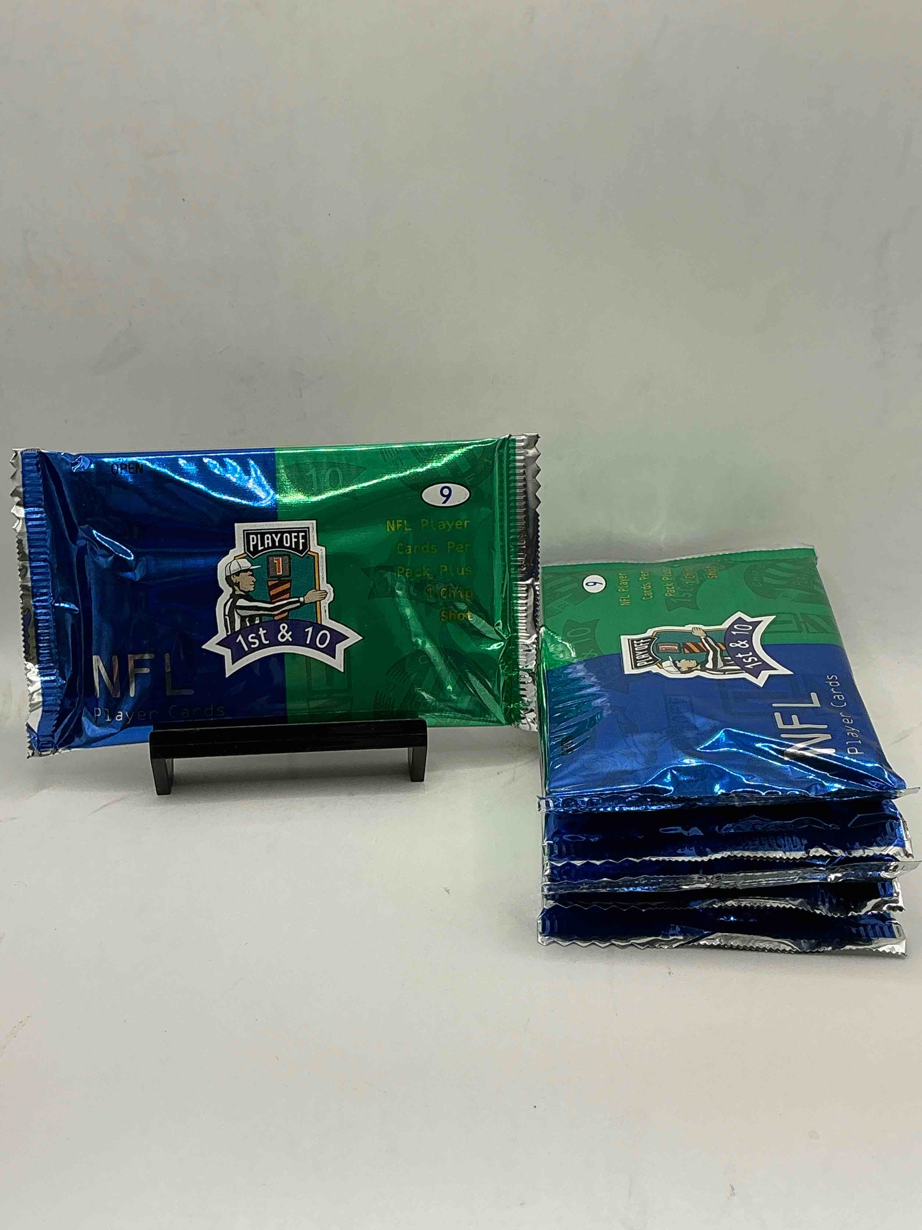 Condition photo showing New/Like New for 1997 playoff 1st & 10 nfl football packs! rare & super cool football packs, look for legends! 9 cards per pack & 1 chip shot! look for jerry rice, joe montana, john elway & more! wow!