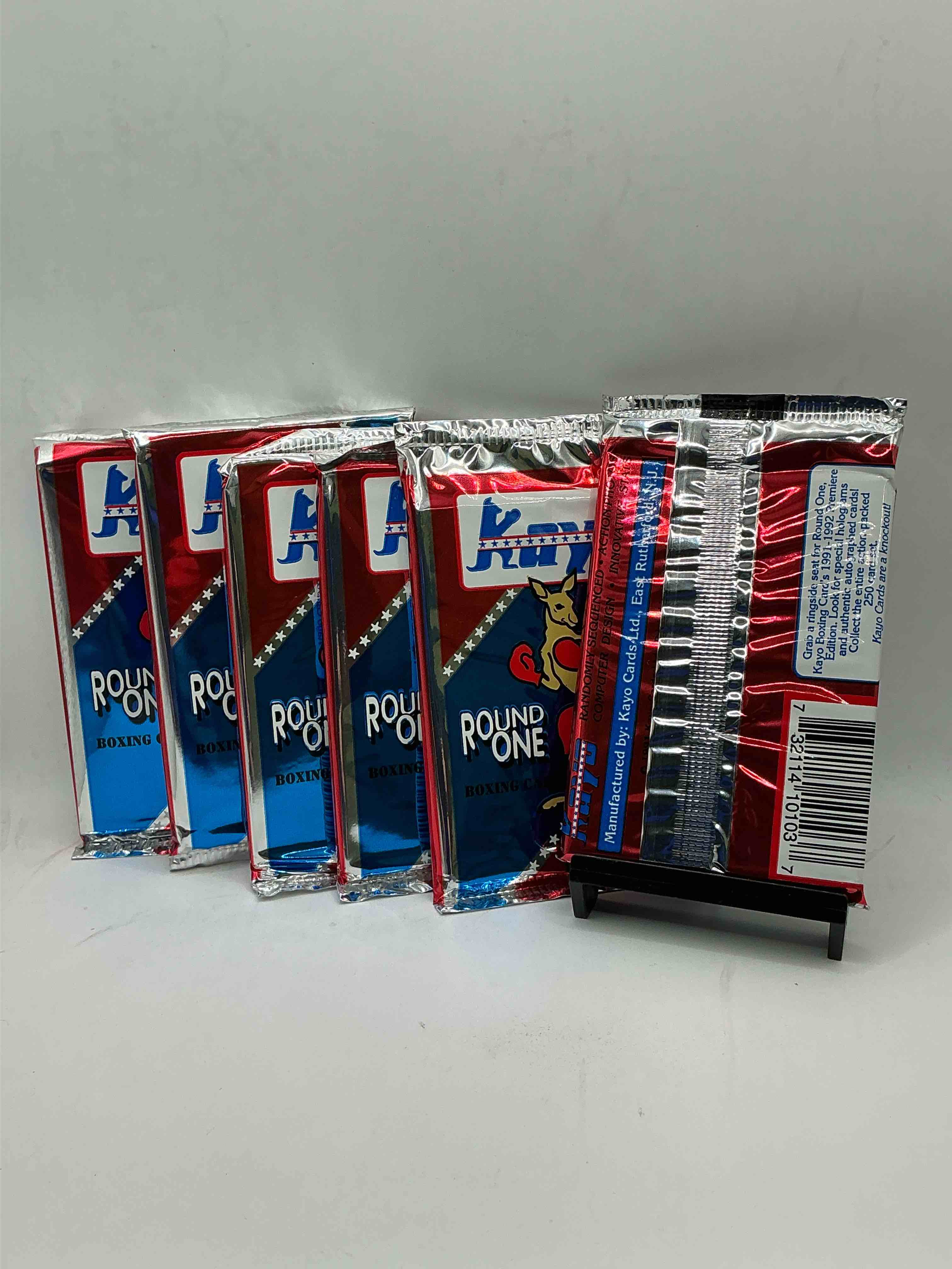 Condition photo showing New/Like New for 1991-92 kayo round one boxing cards! 14 cards per pack! look for roy jones jr, lennox lewis, james toney & more! beautiful packs!
