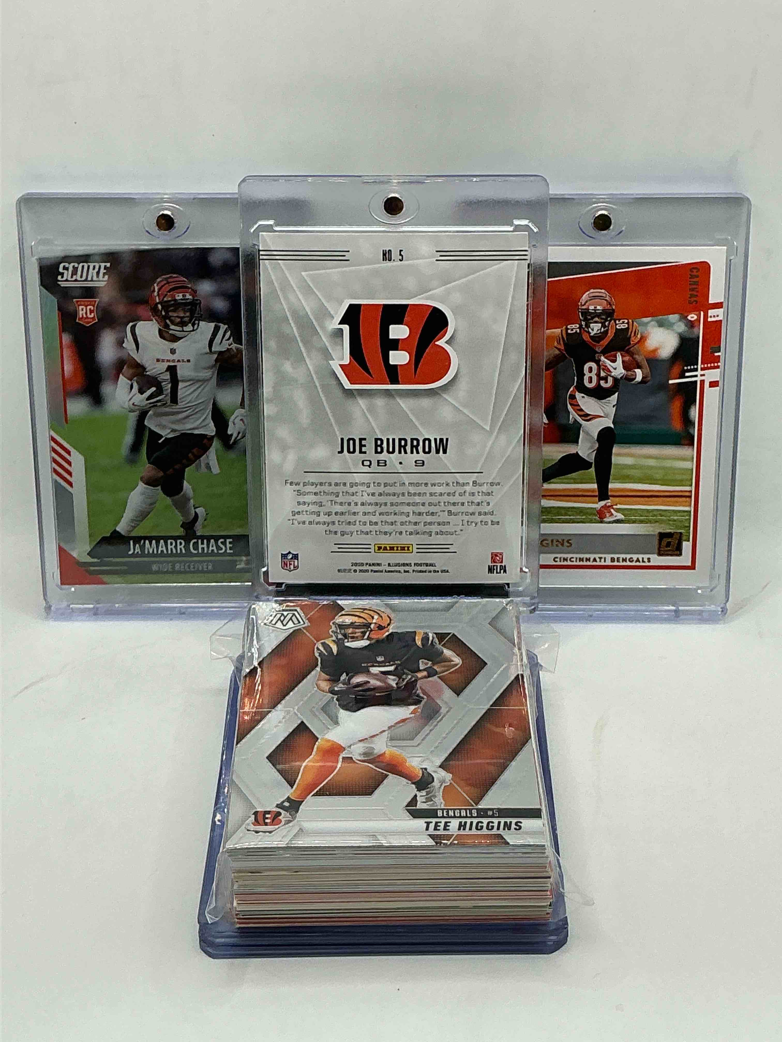 Condition photo showing New/Like New for bengals rookie trio bonanza! joe burrow illusions rookie! tee higgins rated rookie! ja’marr chase score rookie! along with 50 other bengals heroes, rookies, legends & commons! 