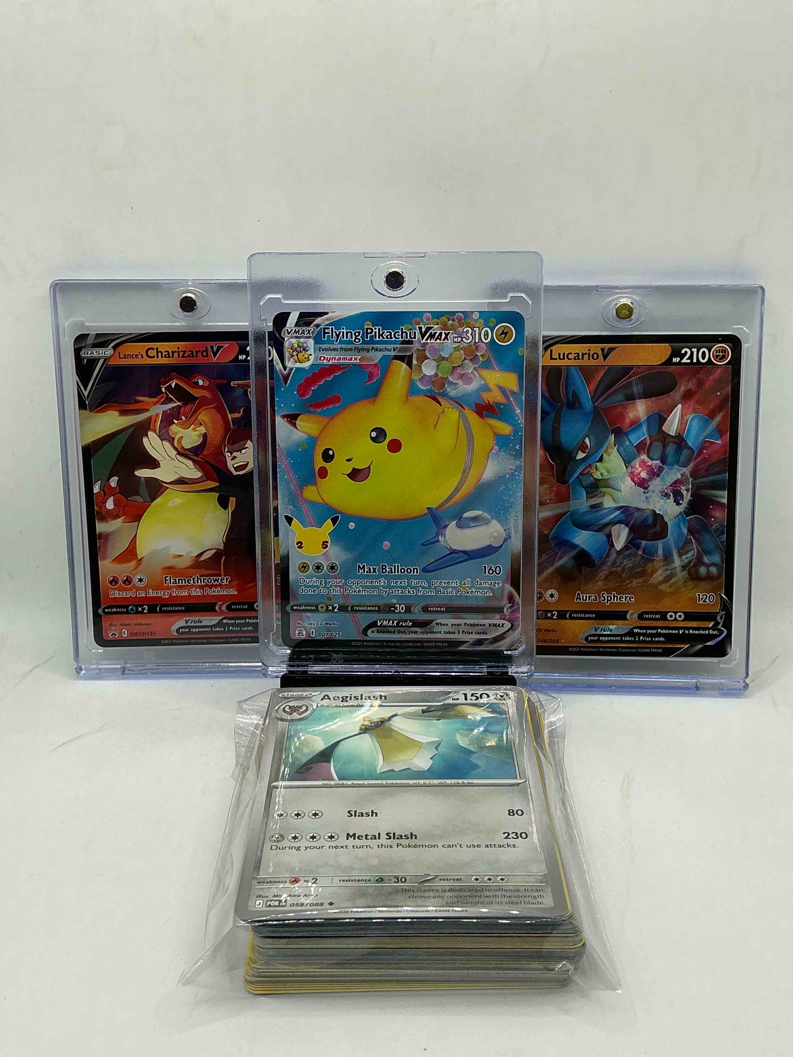 flying pikachu vmax! lance’s charizard v! lucario v! along with 50 other pokémon heroes, holos, legends & commons- including holographic cards, stage 2 cards, holos in all forms & more! also includes 36 non holo common/ uncommon basic & first stage cards trainers & energy too! perfect set for collectors & enthusiasts!