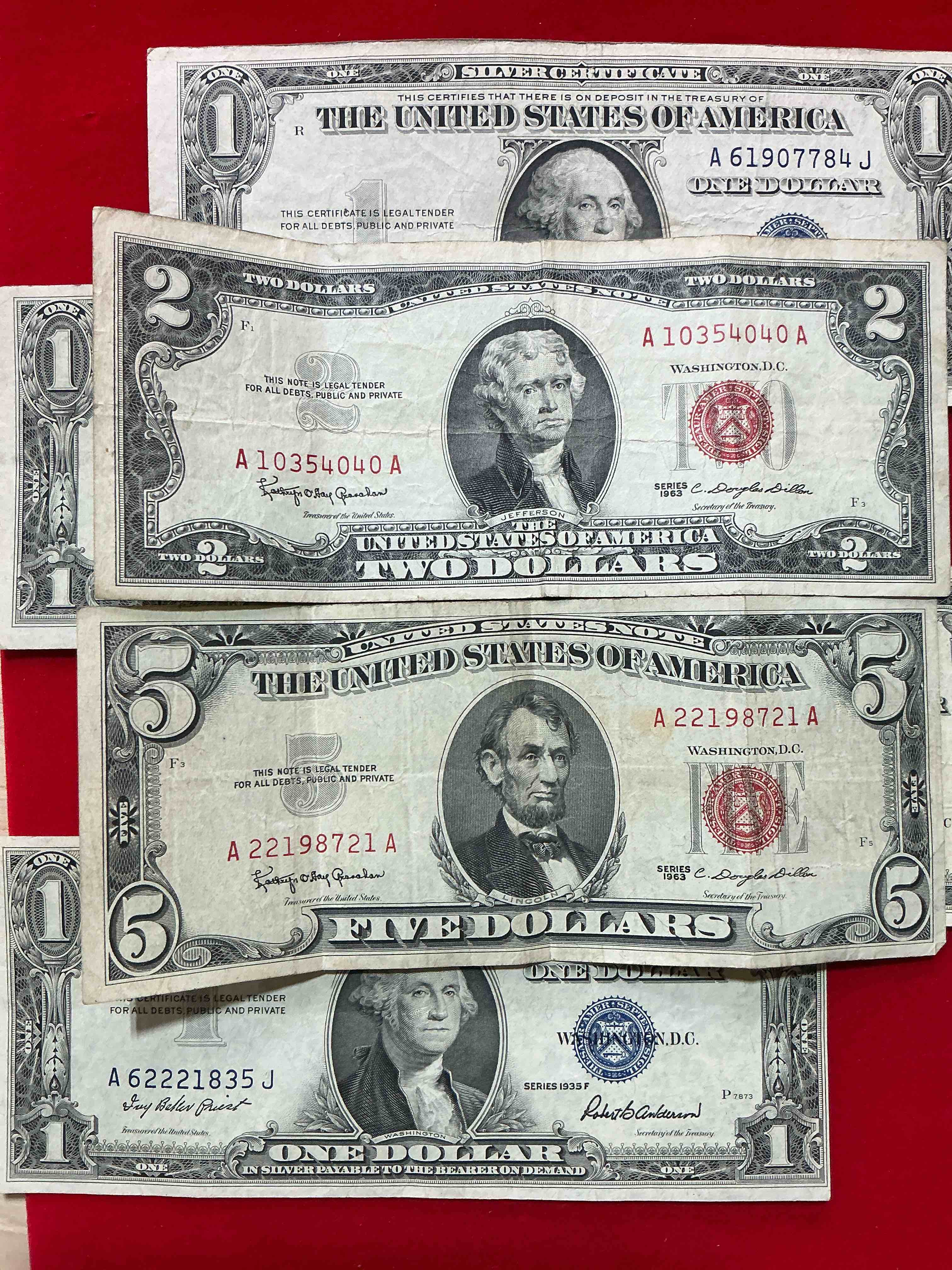 rare american dollar bills! red seal five dollar bill & red seal two dollar bill, along with silver certificates! five dollar bill ultra rare & in good condition, red seal two dollar bill in good condition & silver certificates produced from 1878 to 1964 & are still considered legal tender at face value. here are gorgeous, circulated 1935 & 1957 u.s. one dollar silver certificate, with highly collectible "blue seal!* own an awesome piece of history! american dollar lot! 