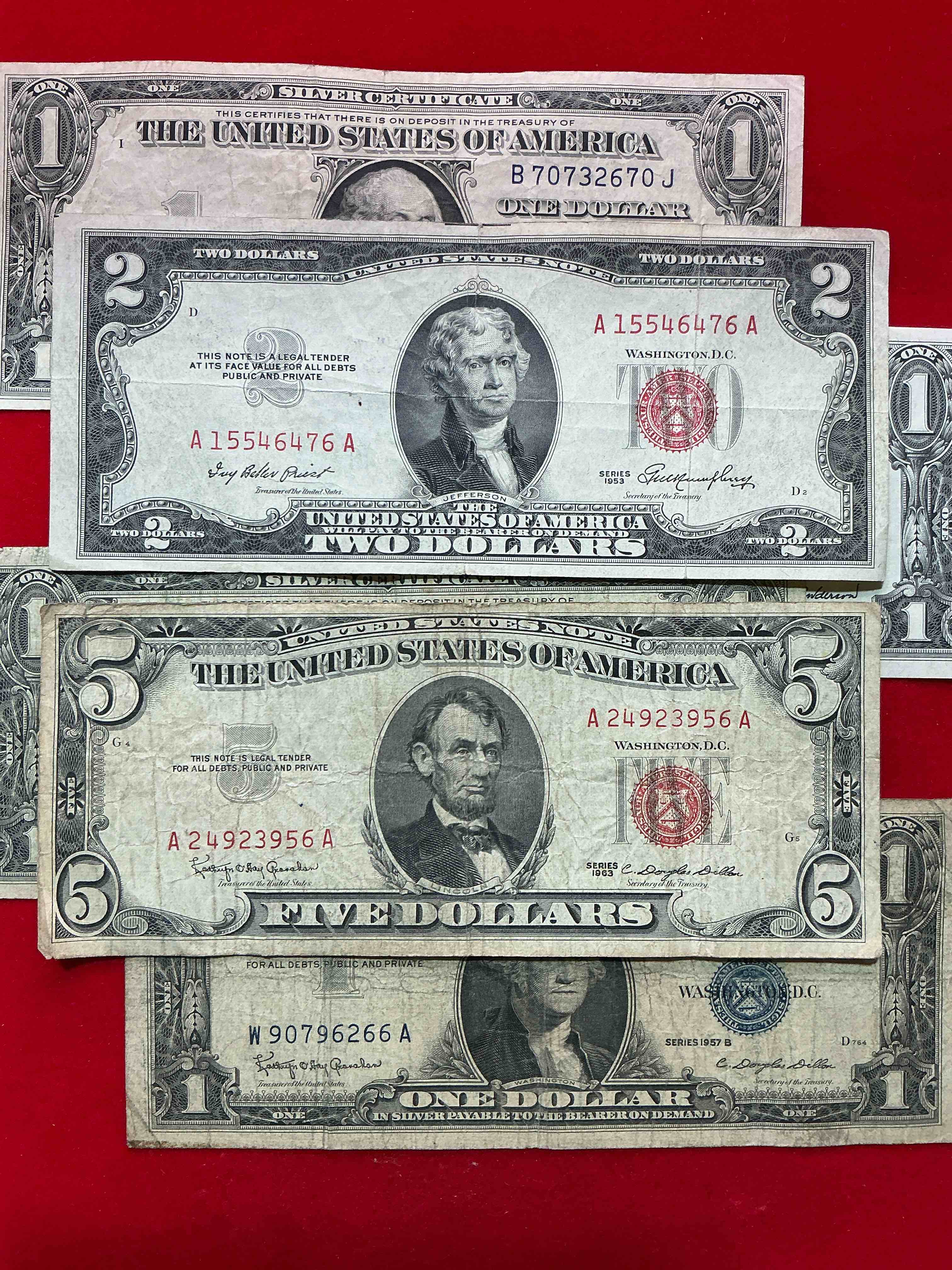 rare american dollar bills! red seal five dollar bill & red seal two dollar bill, along with silver certificates! five dollar bill ultra rare & in good condition, red seal two dollar bill in good condition & silver certificates produced from 1878 to 1964 & are still considered legal tender at face value. here are gorgeous, circulated 1935 & 1957 series u.s. one dollar silver certificate, with highly collectible "blue seal!* own an awesome piece of history! american dollar lot! 